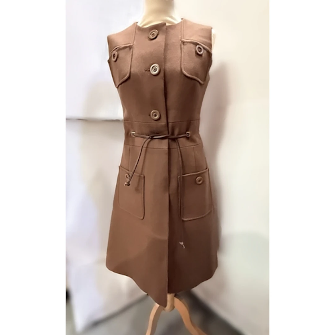 A vintage early 1970's brown wool sleeveless button through ...