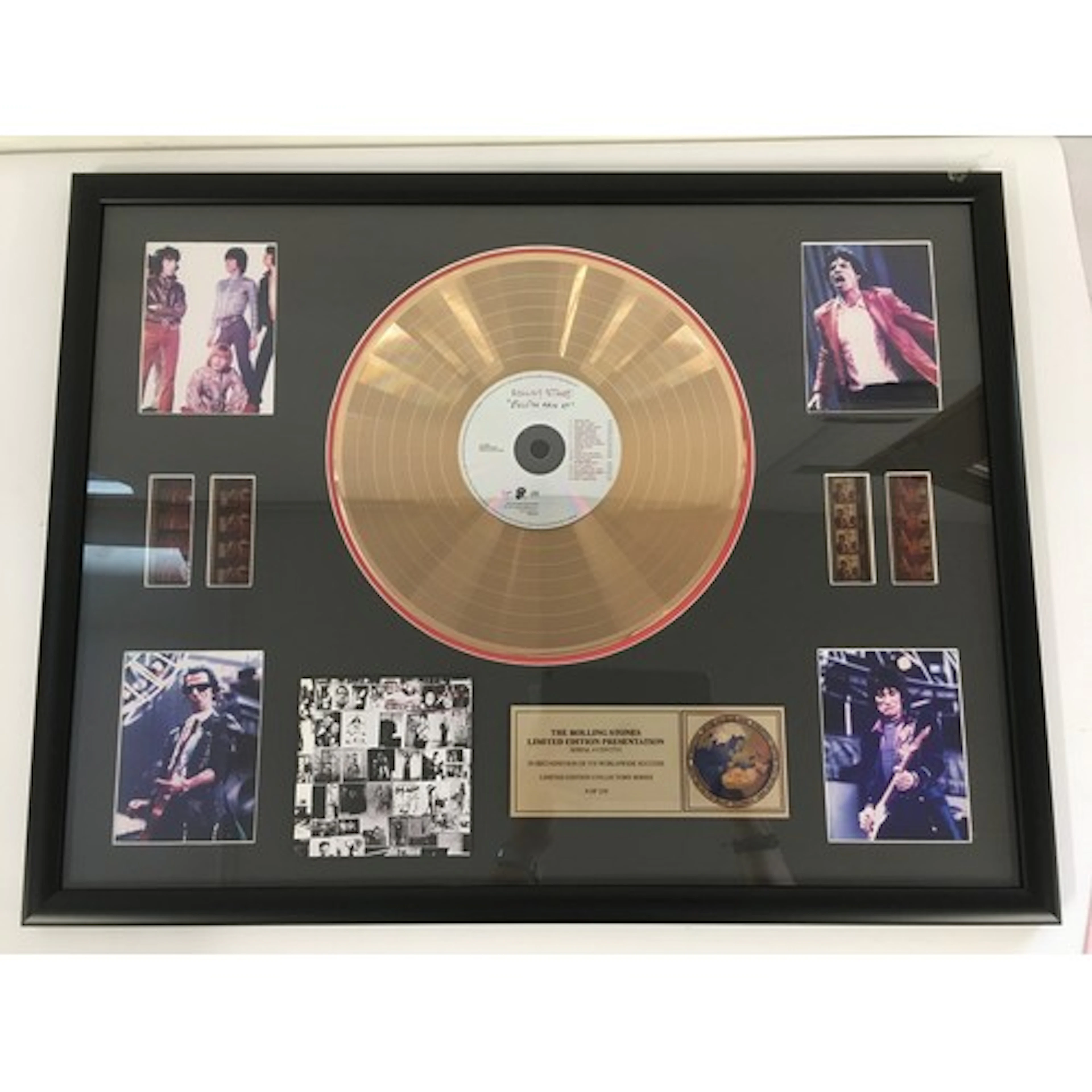 A framed and limited edition Rolling Stones gold disc CD dis...