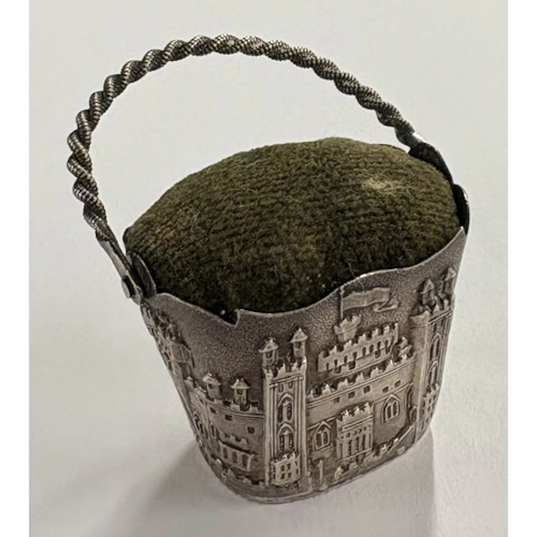 A Victorian silver castle top pin cushion. Approx. 10 grams ...