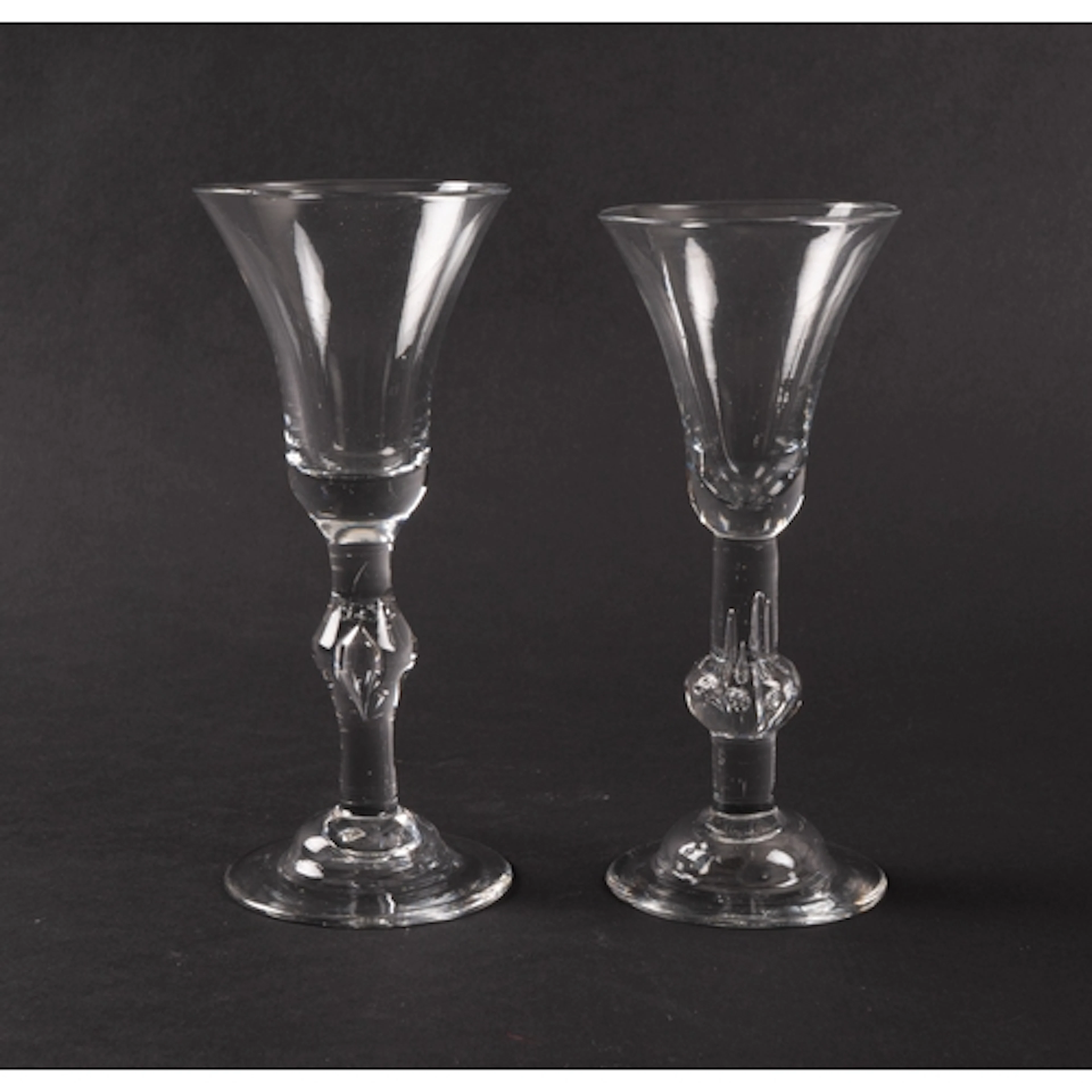 Two baluster wine glasses, c.1740, one with a bell bowl rais...