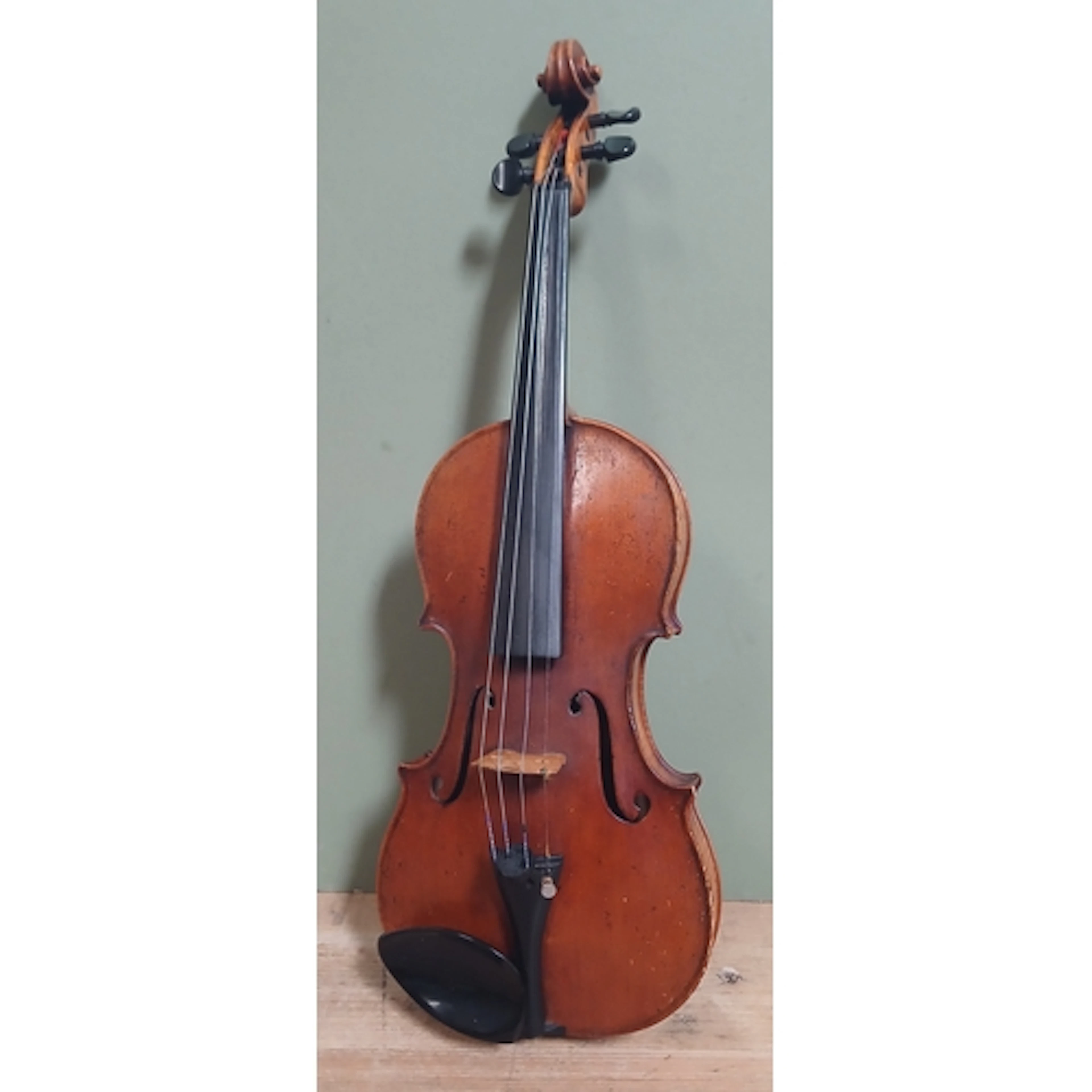 An antique violin, single piece back, length 356mm, bearing ...