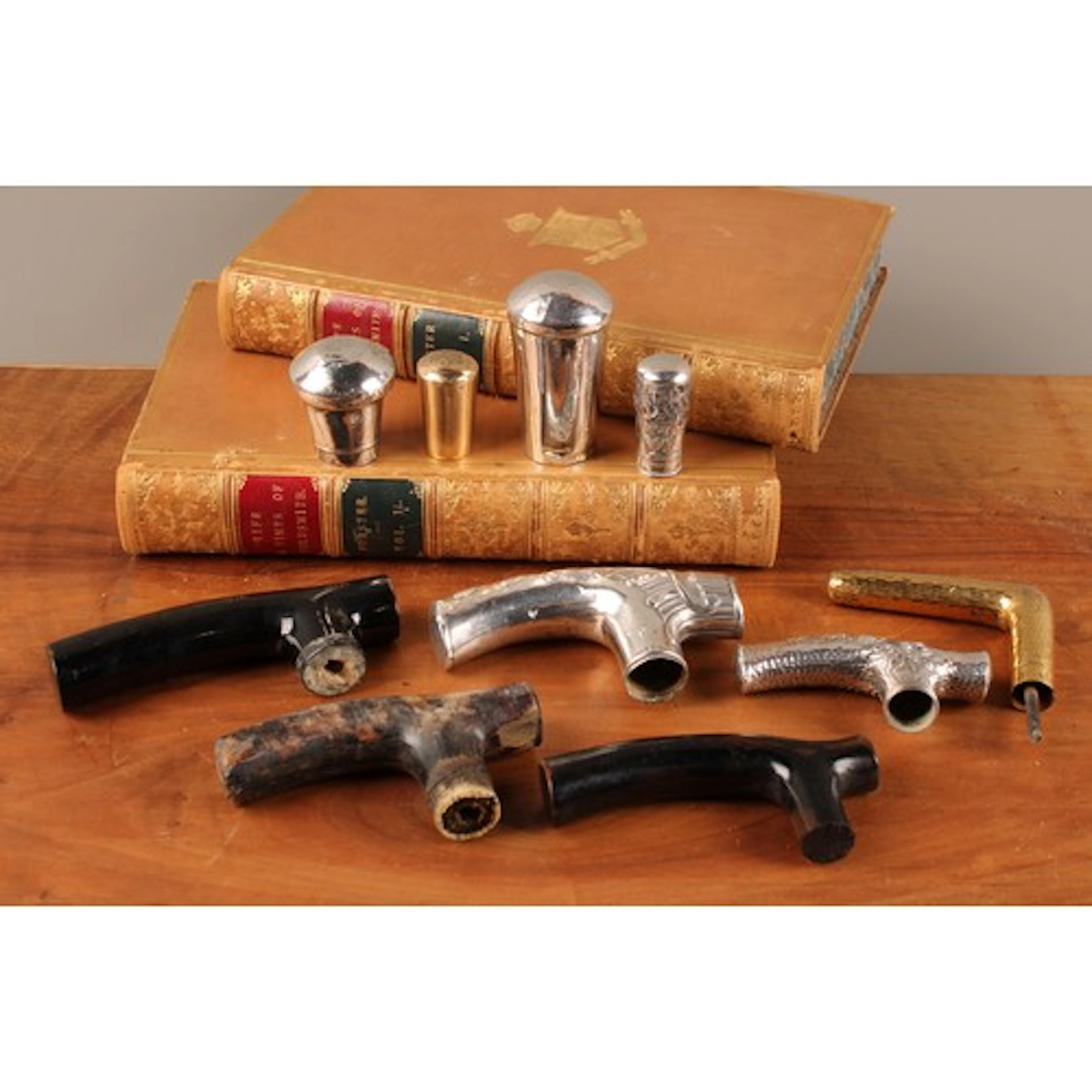 A collection of 19th and early 20th century walking cane han...