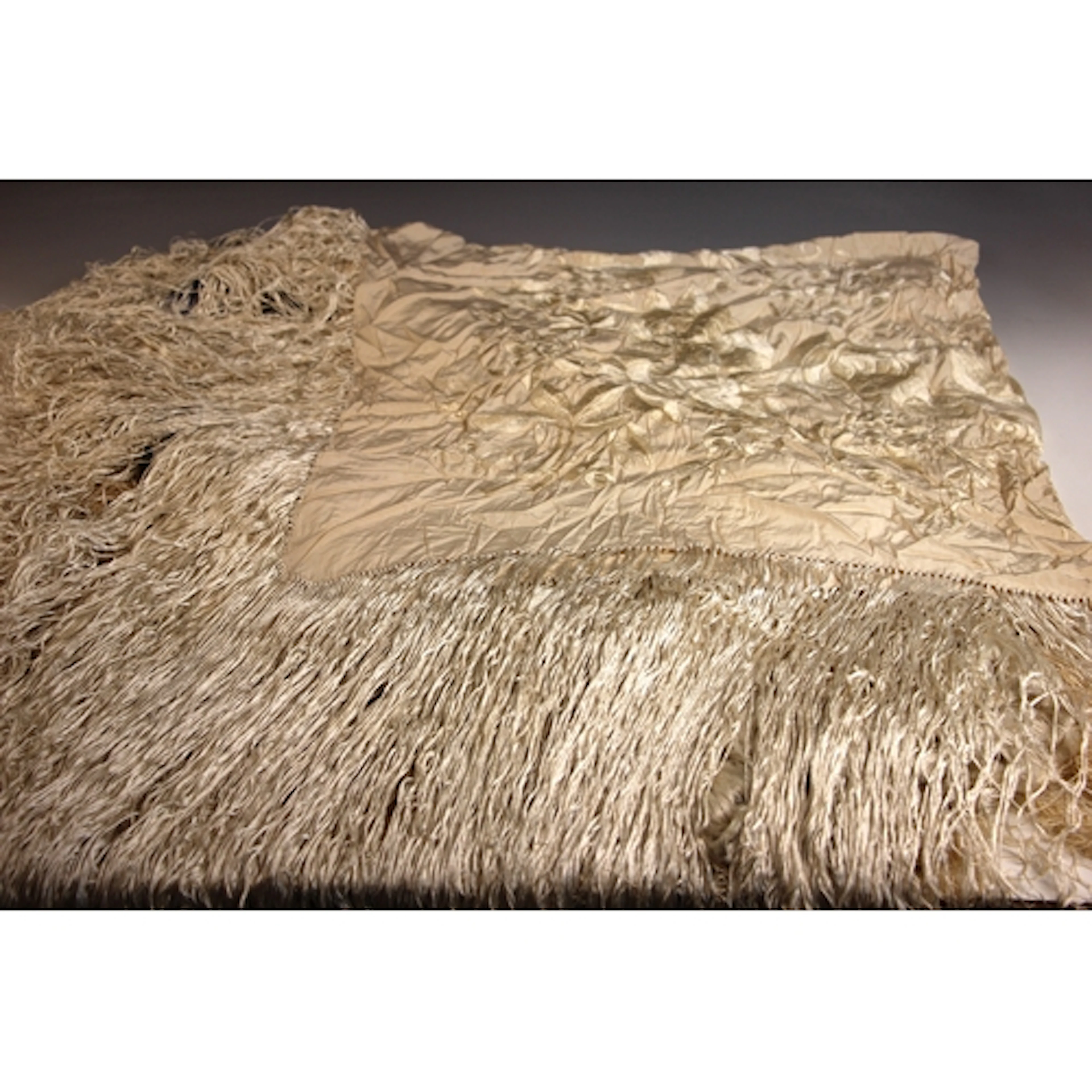 A Chinese silk embroidered ivory piano shawl, the florally e...