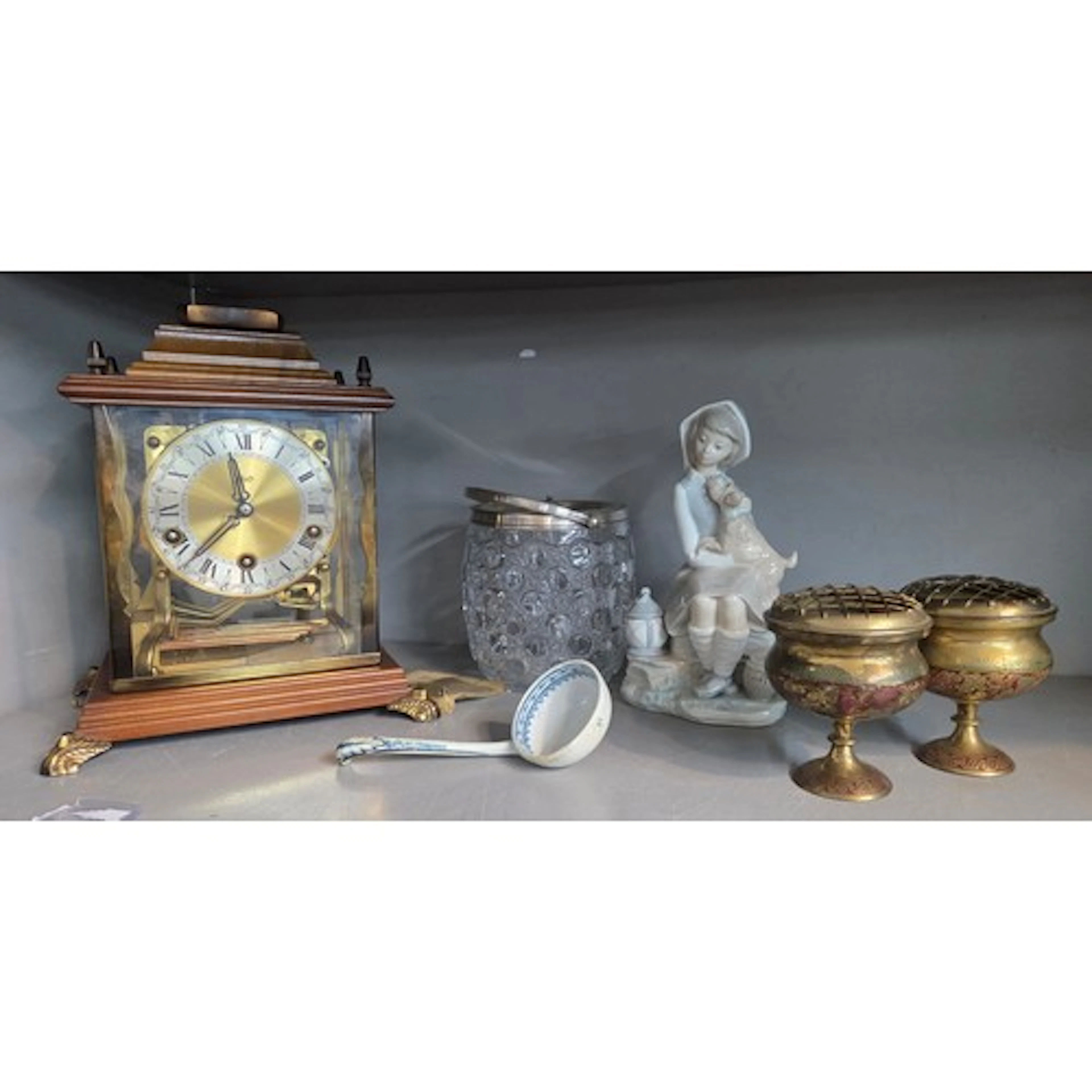 A Schatz mahogany and brass bracket style clock, a Lladro po...