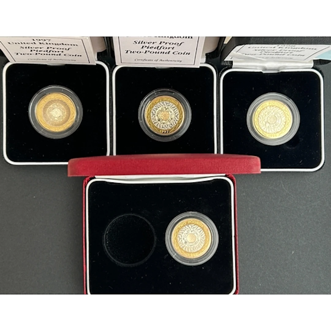 A group of four UK QEII silver proof piedfort £2 coins, date...
