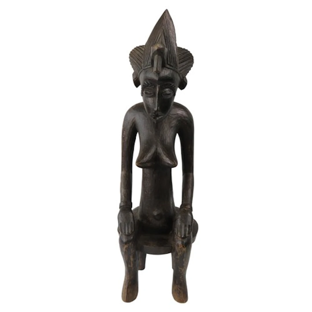 A SENUFO MATERNITY FIGURE the seated female with characteris...
