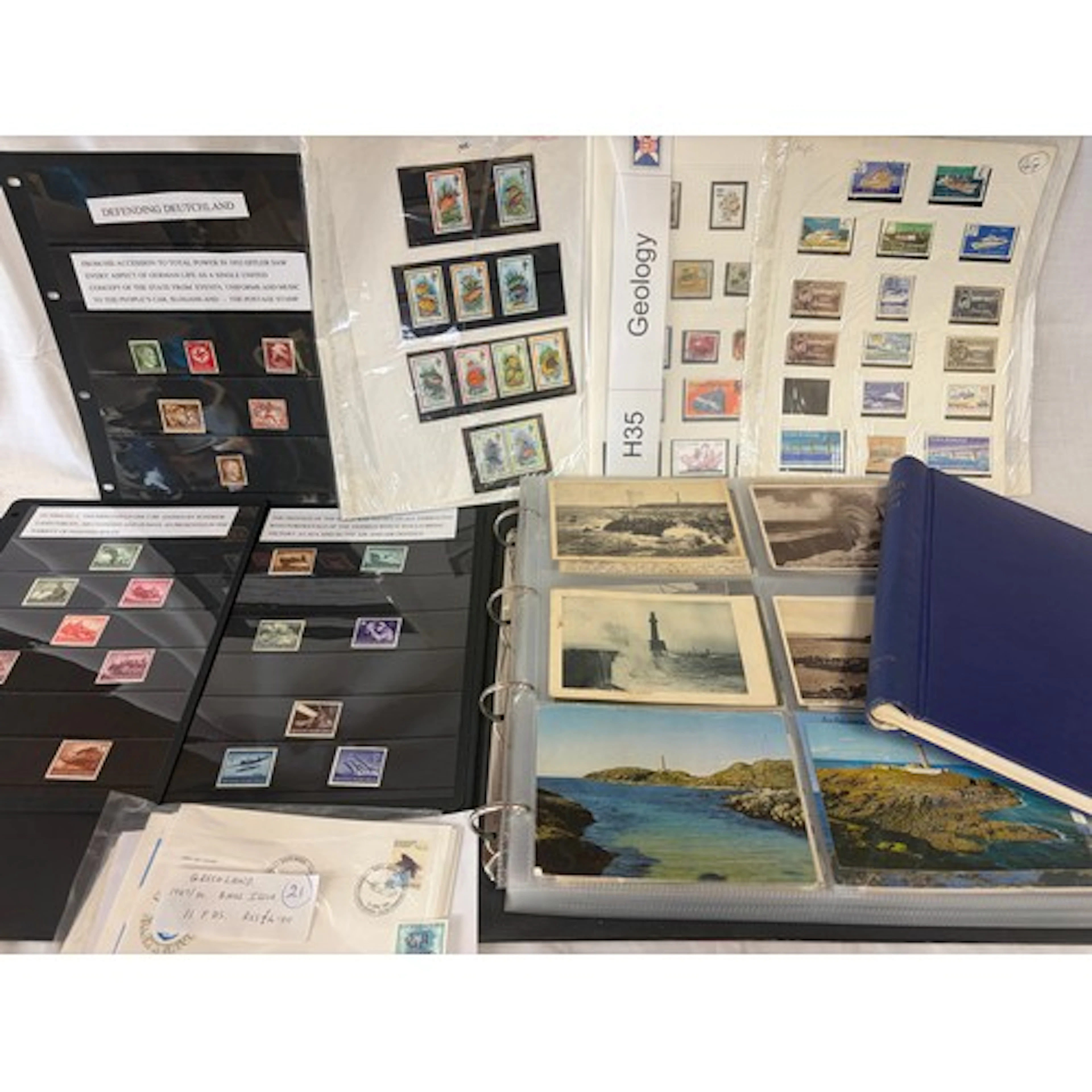 A collection of stamps and postcards to include an album fea...