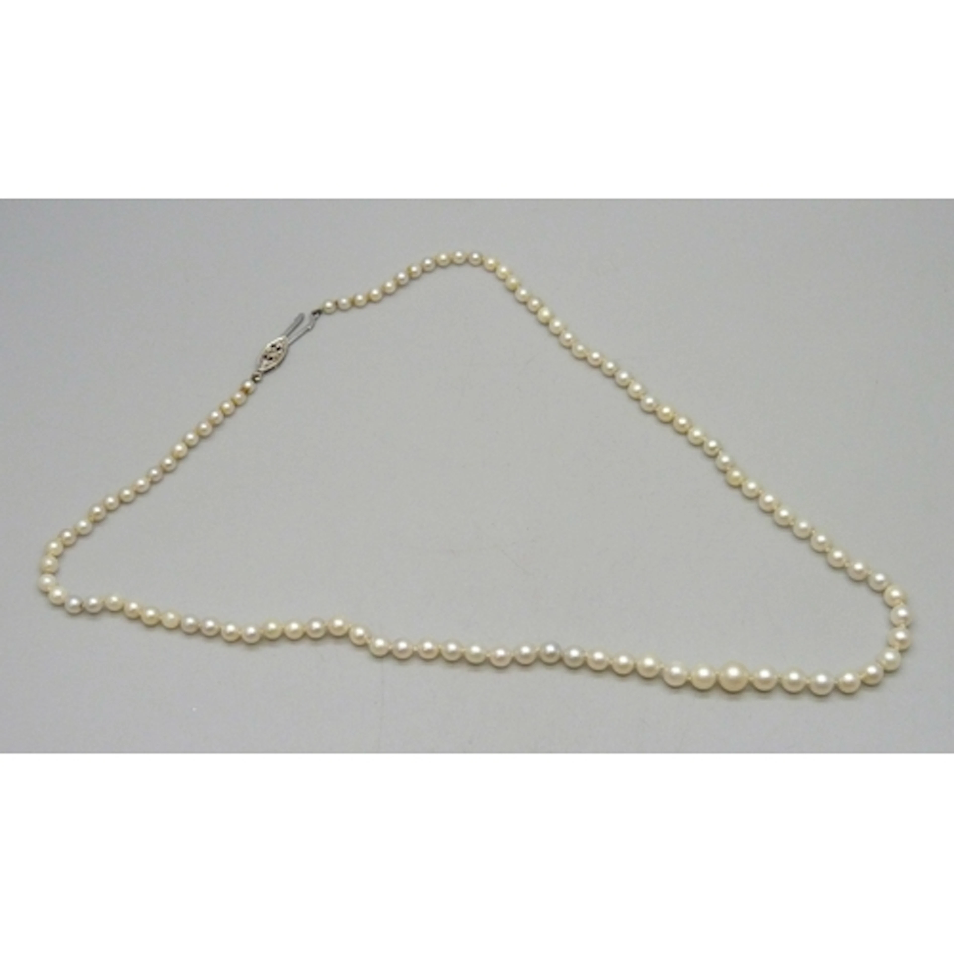 A graduated pearl necklace with a 9ct white gold clasp set w...