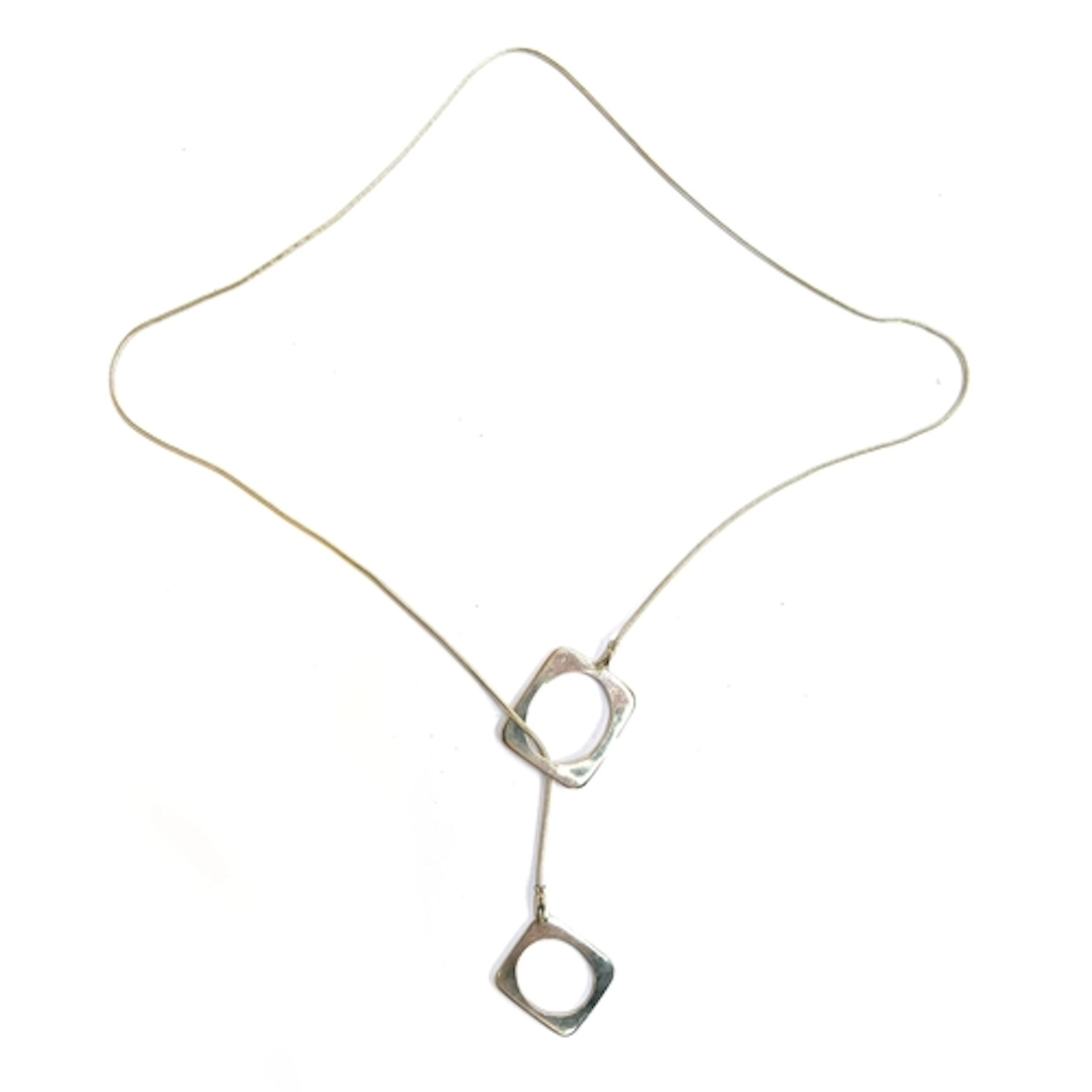 A modernist silver snakechain necklace with square loop pend...