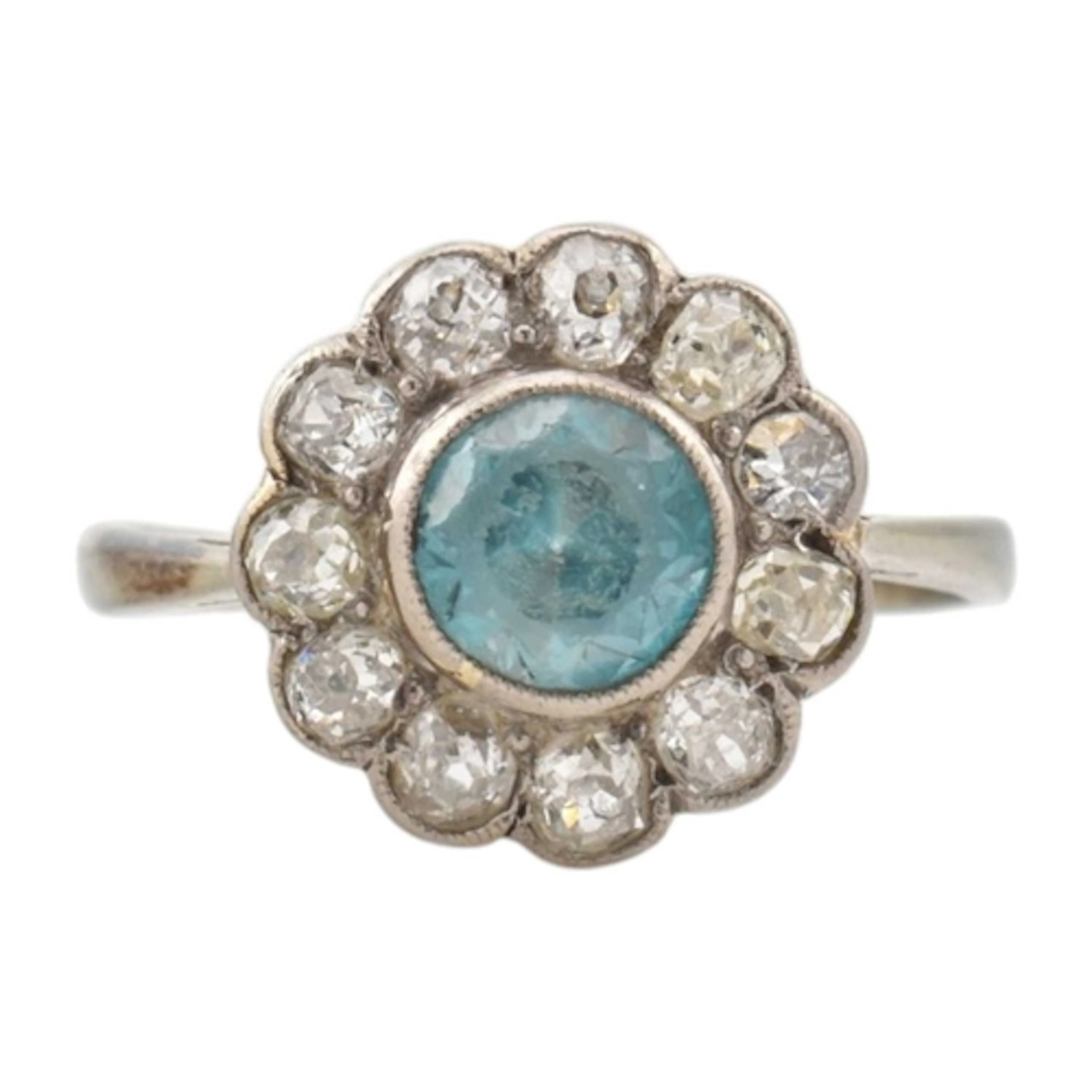 An early 20th century zircon and diamond cluster ring. The r...