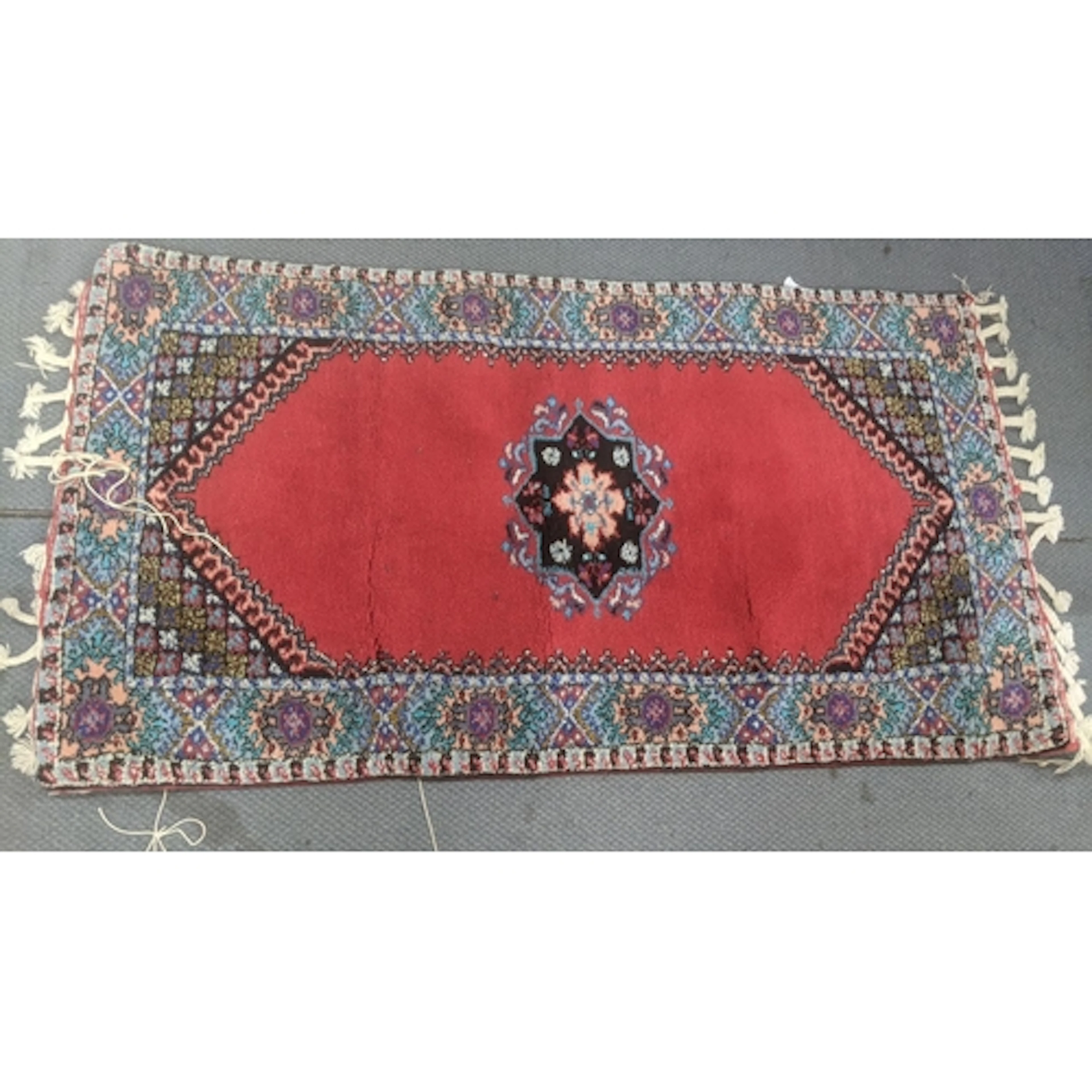 A pair of Moroccan hand knotted prayer rugs having a central...
