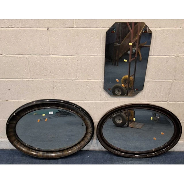 TWO OVAL WALL MIRRORS, along with another wall mirror (larg...