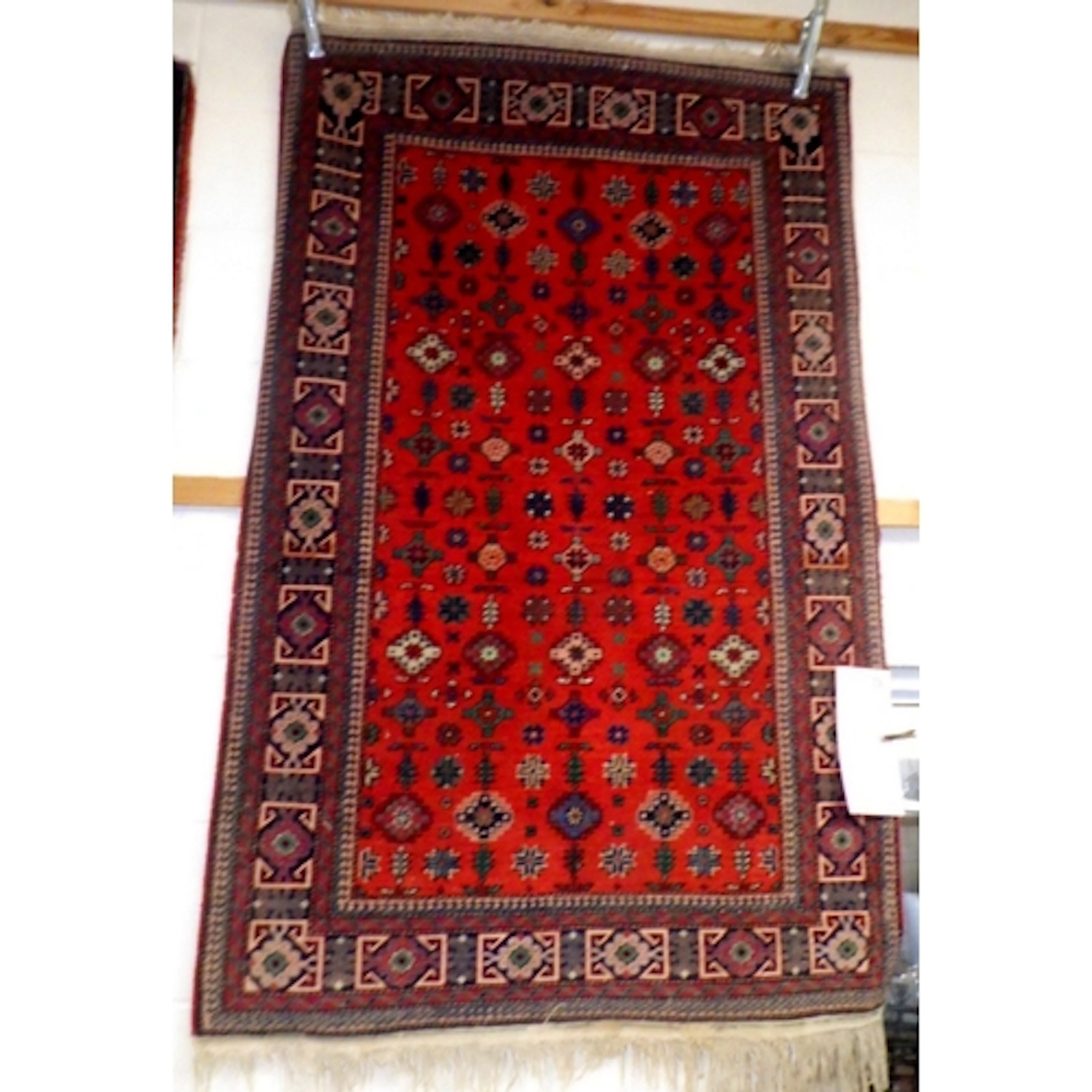 A Shirvan style red ground rug approx 100 x 160cm