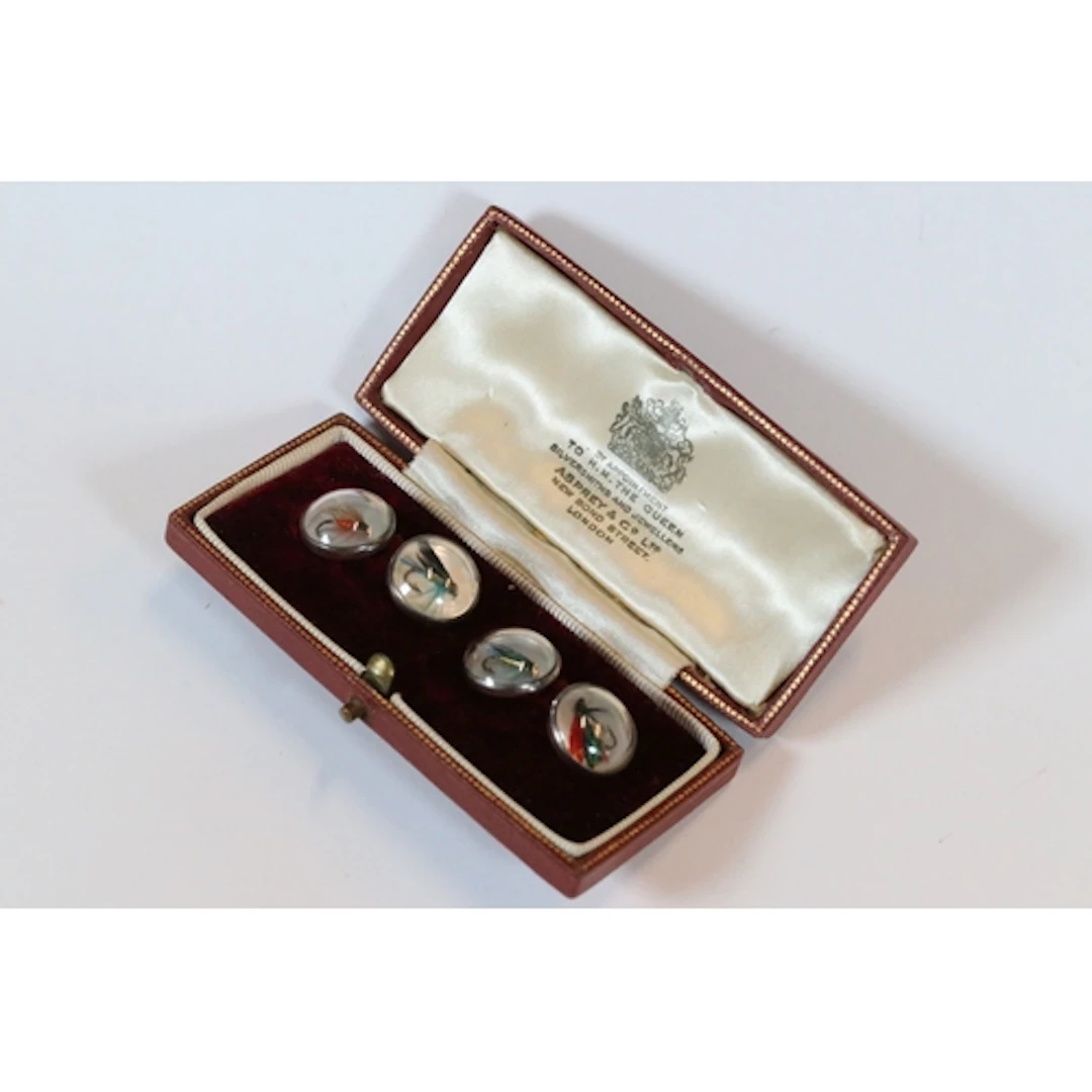 Pair of silver mounted cufflinks of circular form, with fish...