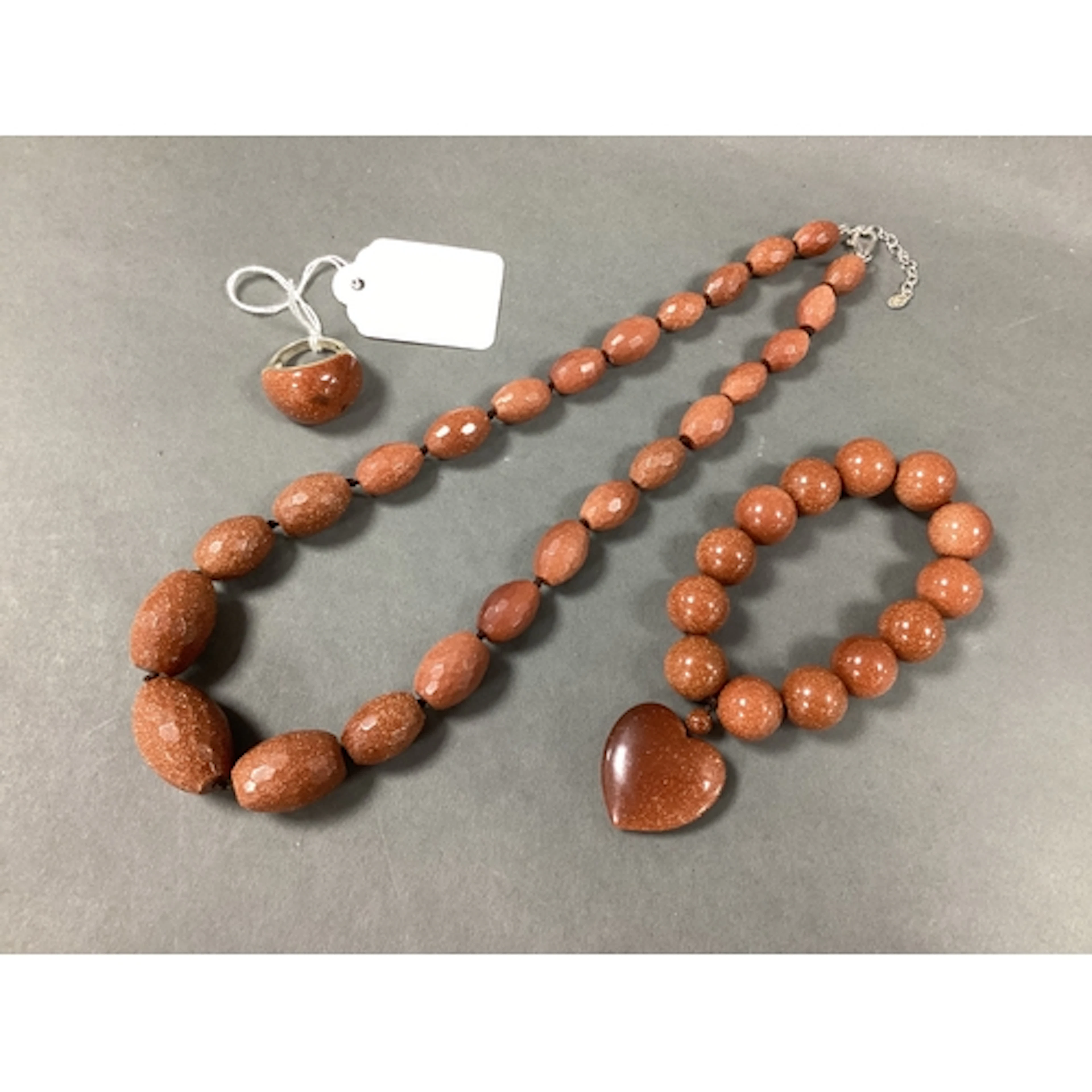 QVC; A Chunky Hallmarked Silver and Goldstone Dress Ring, of...