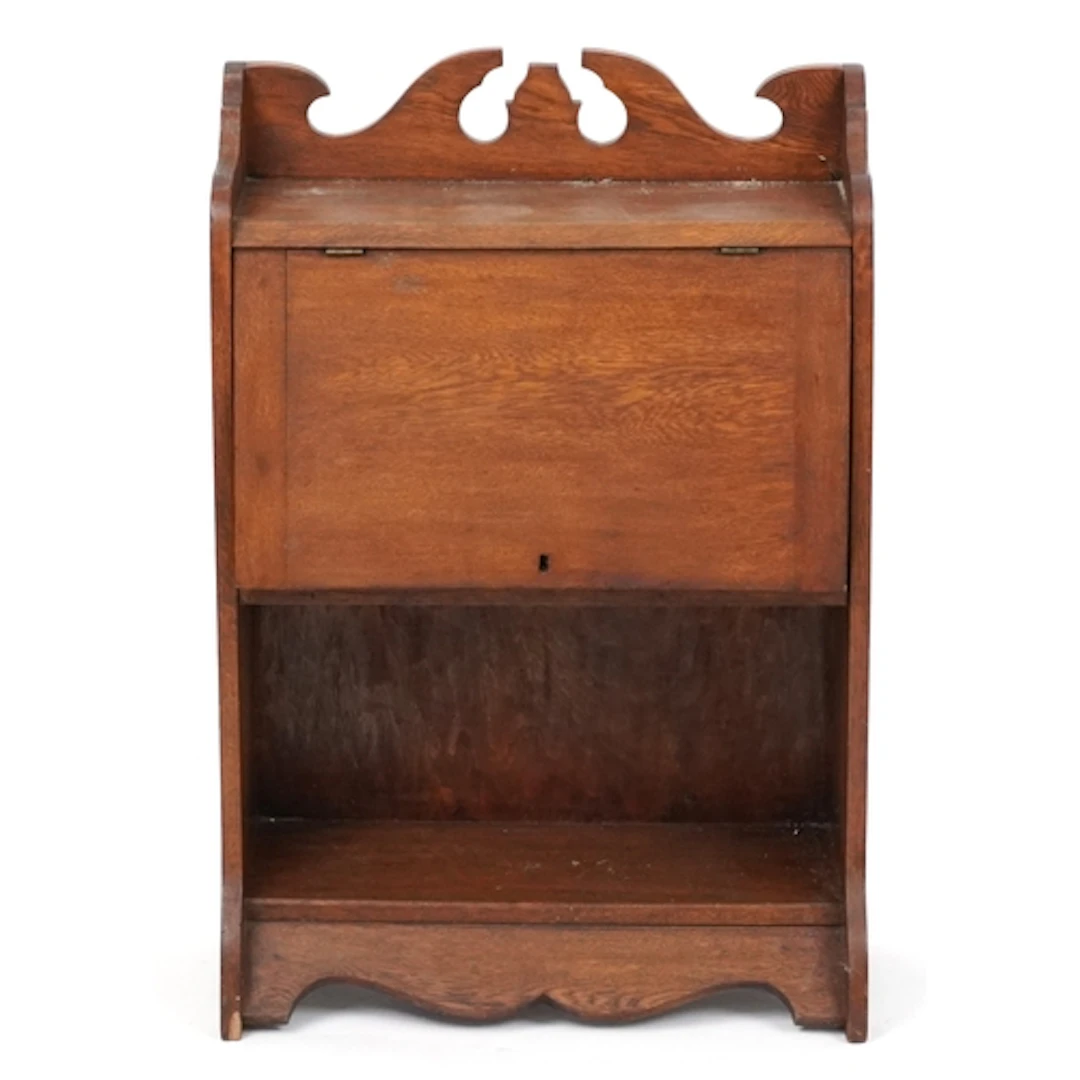 Arts & Crafts oak cabinet, the door enclosing a fitted inter...