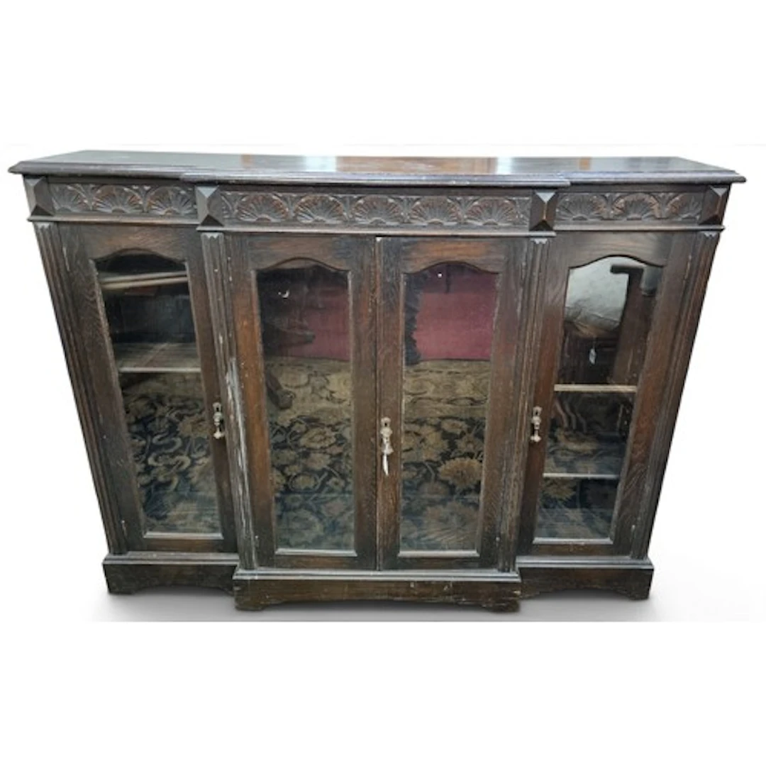 A late 19th Century Oak four door breakfront glazed Cabinet....