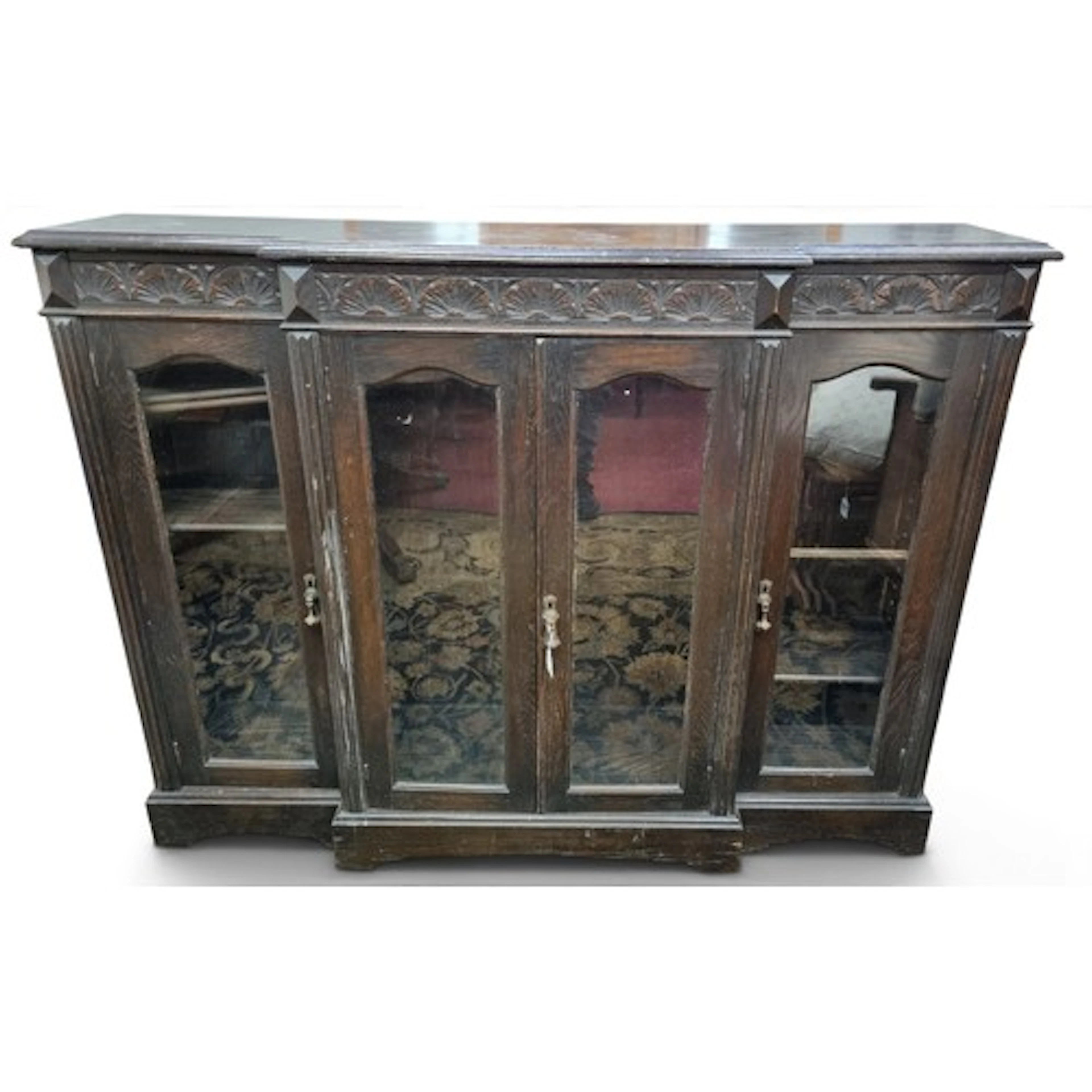 A late 19th Century Oak four door breakfront glazed Cabinet....