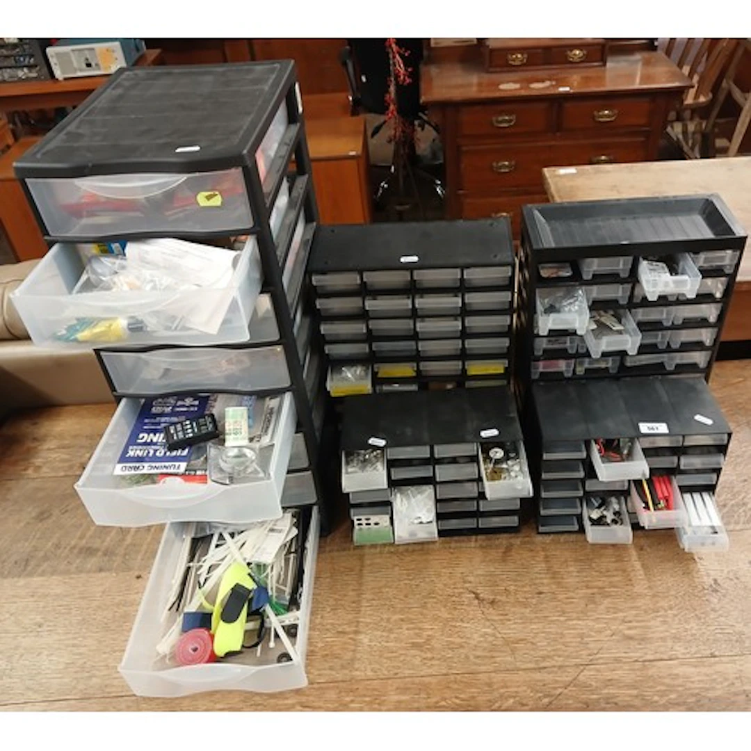 Five boxes of assorted model parts, tools, electronics, batt...