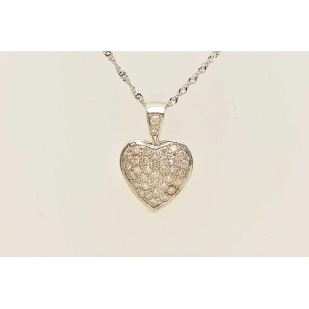 A 9CT WHITE GOLD HEART PENDANT NECKLACE, a white gold heart,...