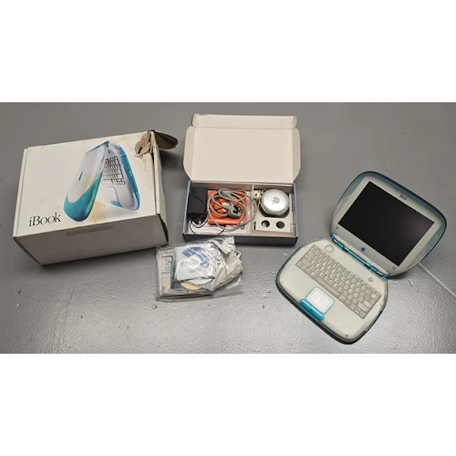 A vintage Apple iBook laptop computer in original packaging ...