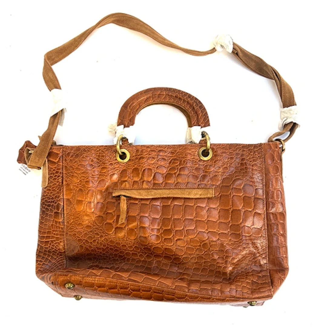A brand new faux alligator brown leather handbag