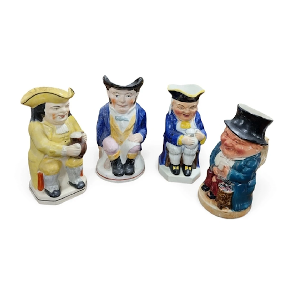 A group of four 19th Century and later Toby Jugs. TB 25 cm a...