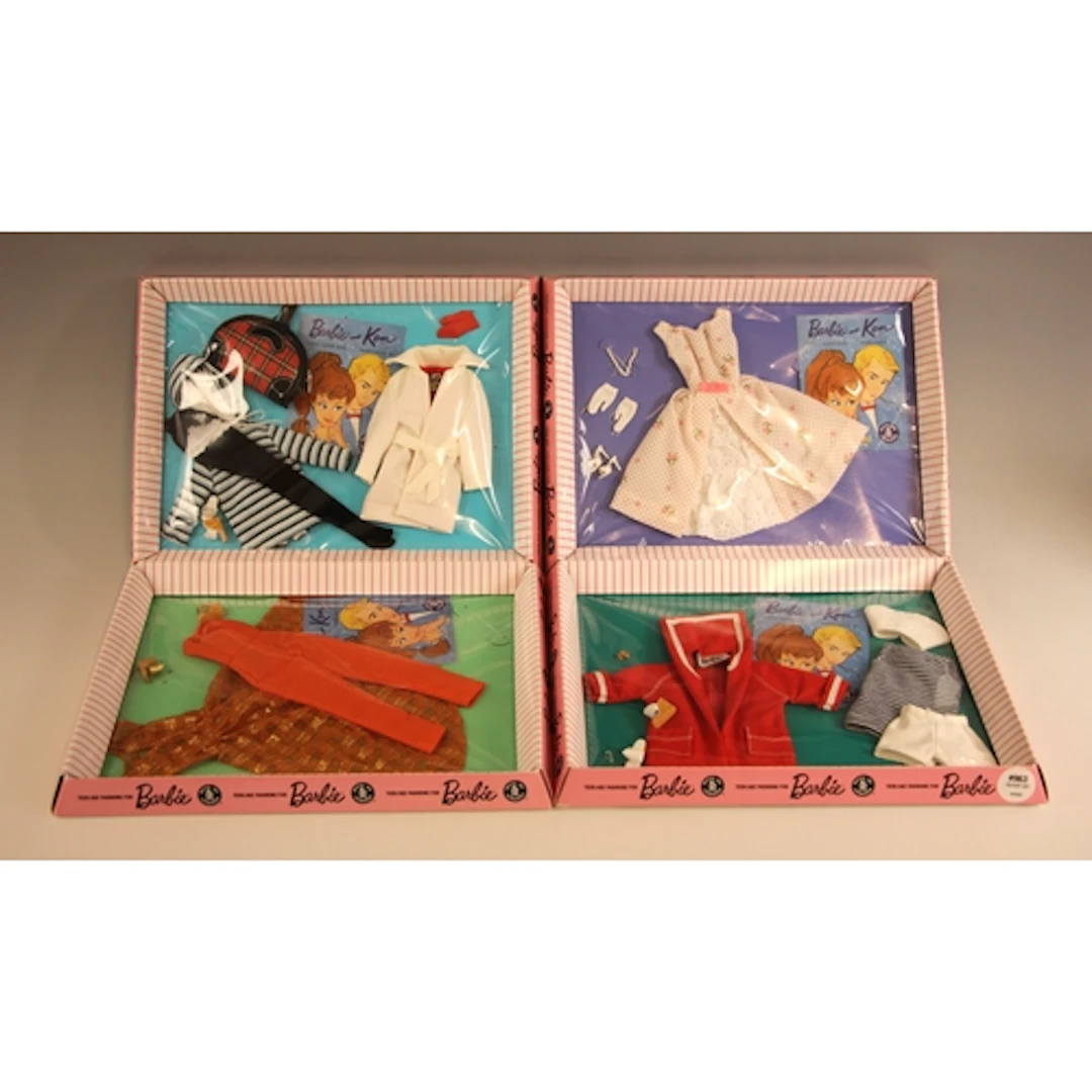 A quantity of Barbie clothes and outfits, to include: four v...