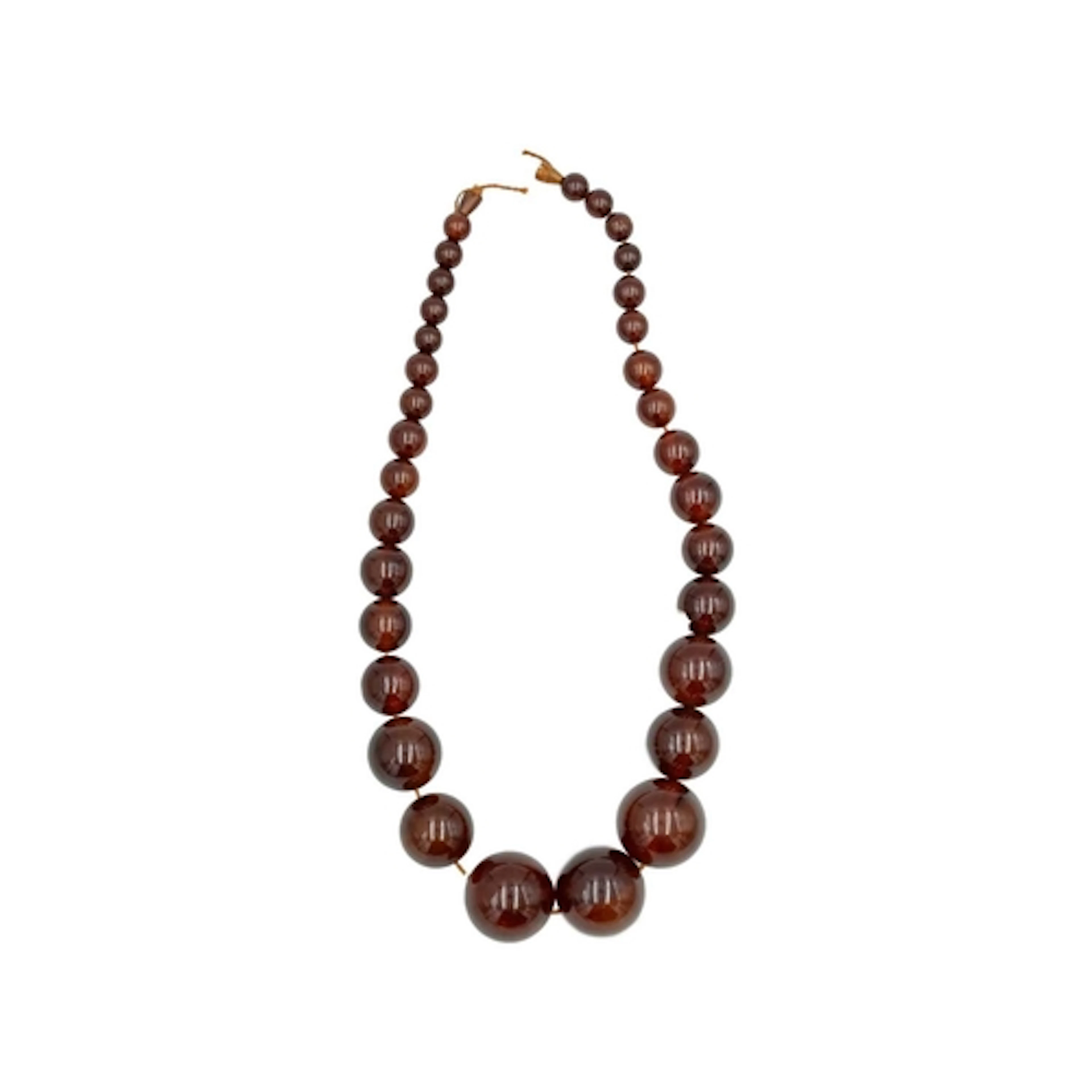 A cognac amber-style graduated ovoid bead necklace. The larg...