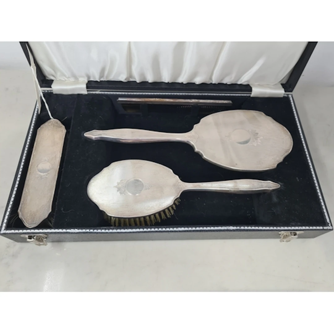 An Elizabeth II silver mounted four piece Dressing Table Set...