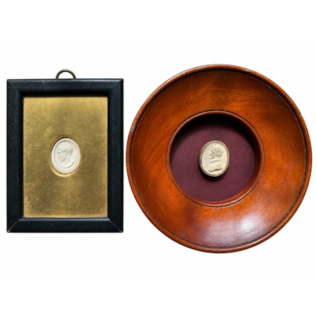 Two framed Grand Tour plaster impressions after engraved gem...