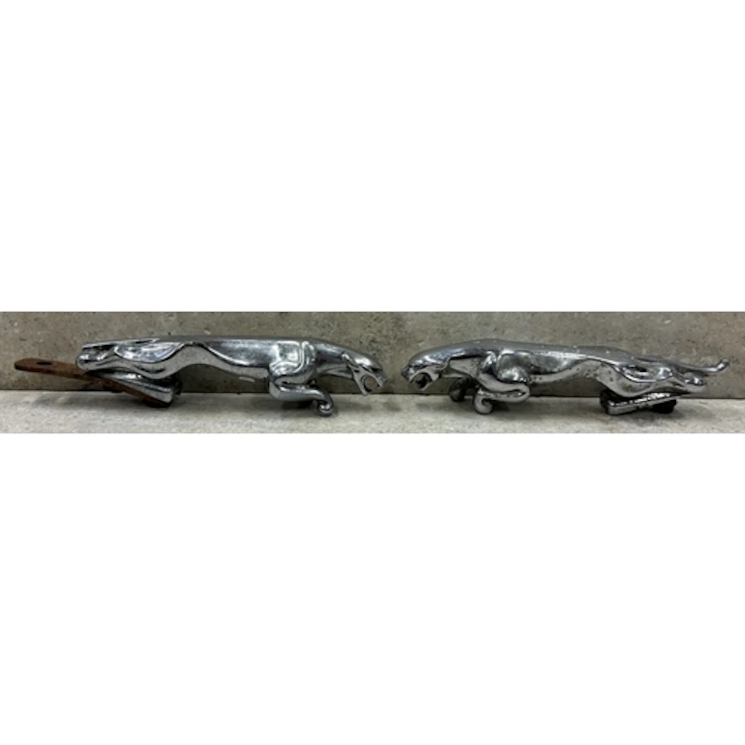 Two 8" Jaguar bonnet mascots. Est. £20 - £30.