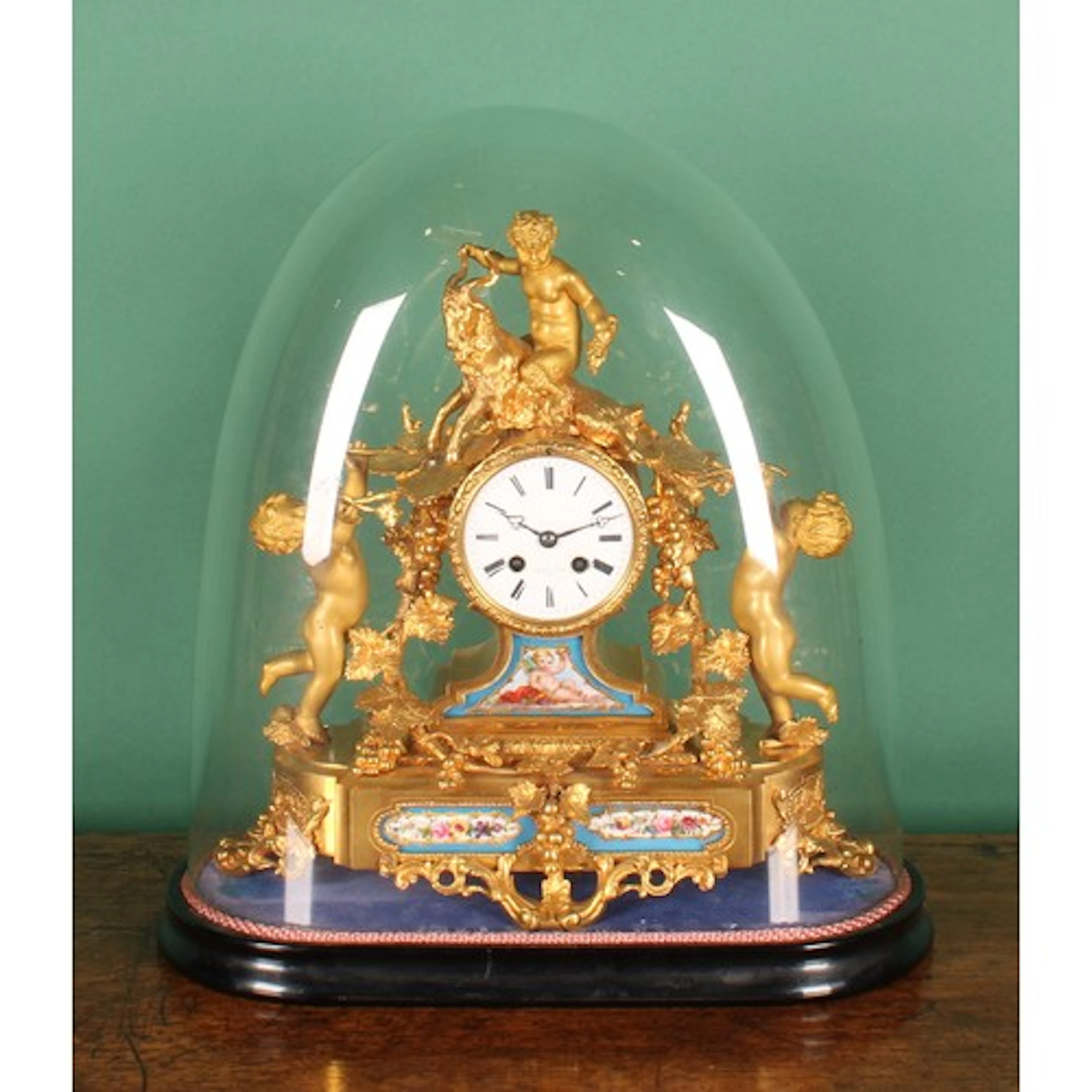 A 19th century French gilt bronze and porcelain mantel clock...