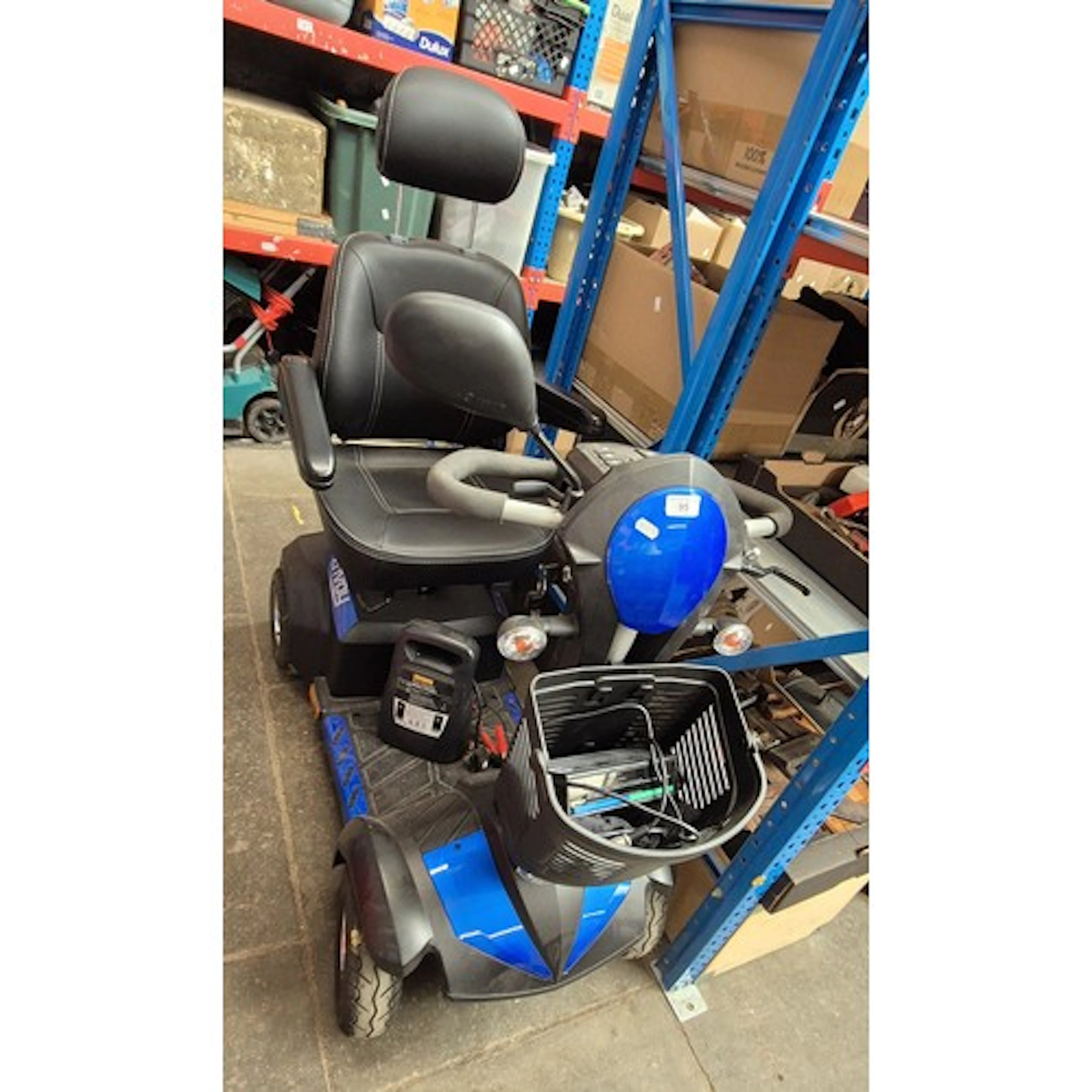 An Envoy mobility scooter in working order with spare batter...