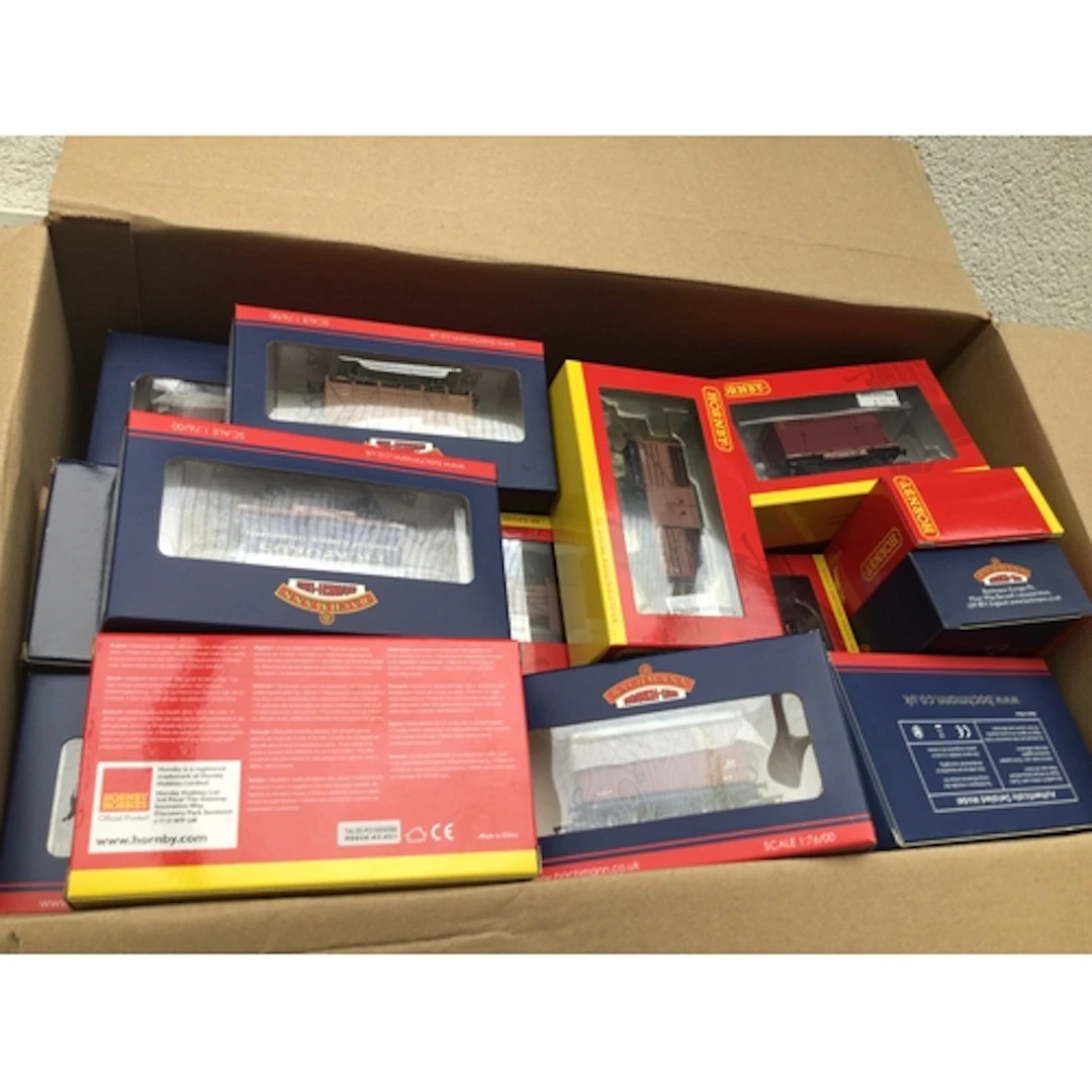 A collection of boxed model railway wagons and coaches by Ho...