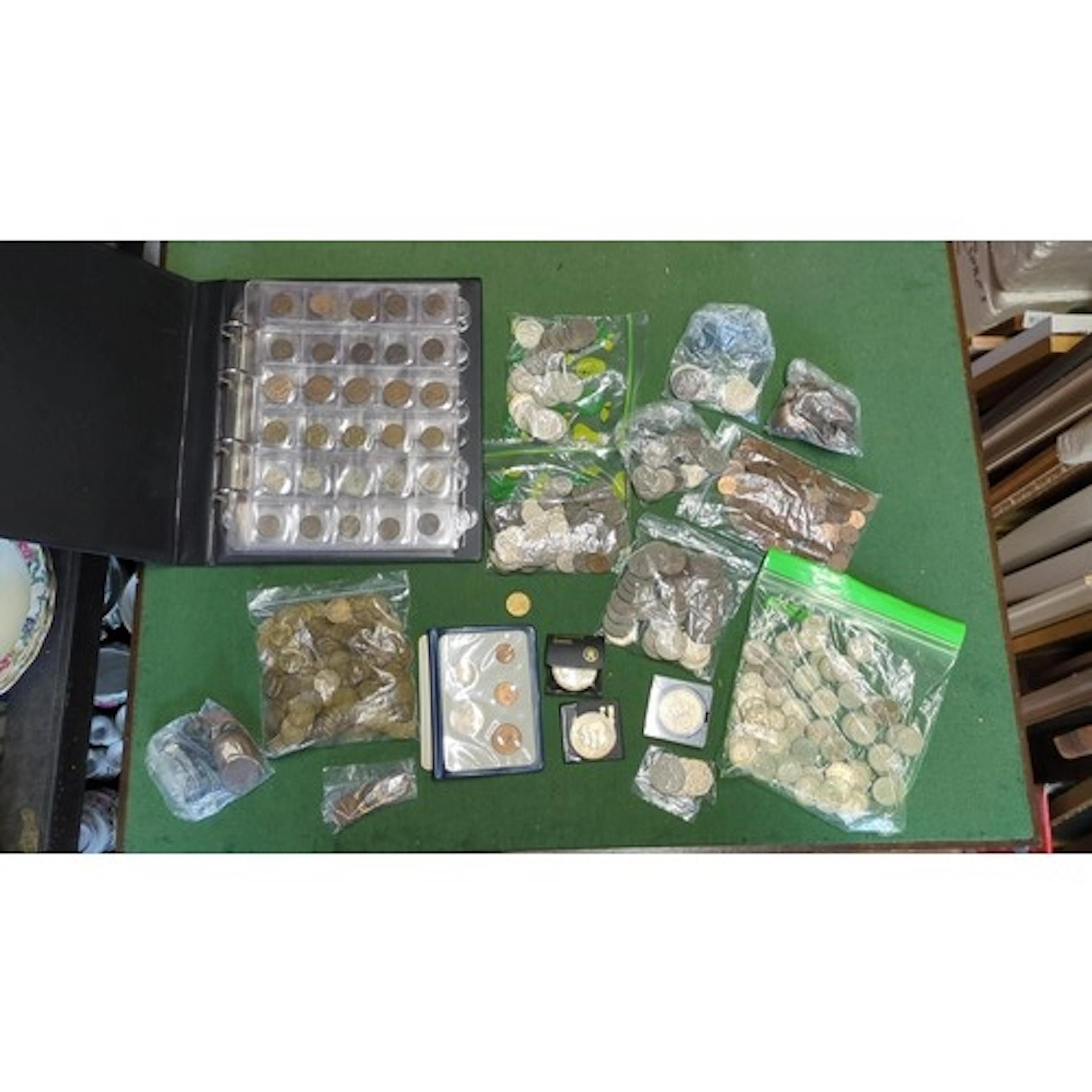 A collection of assorted British and world coinage, predomin...