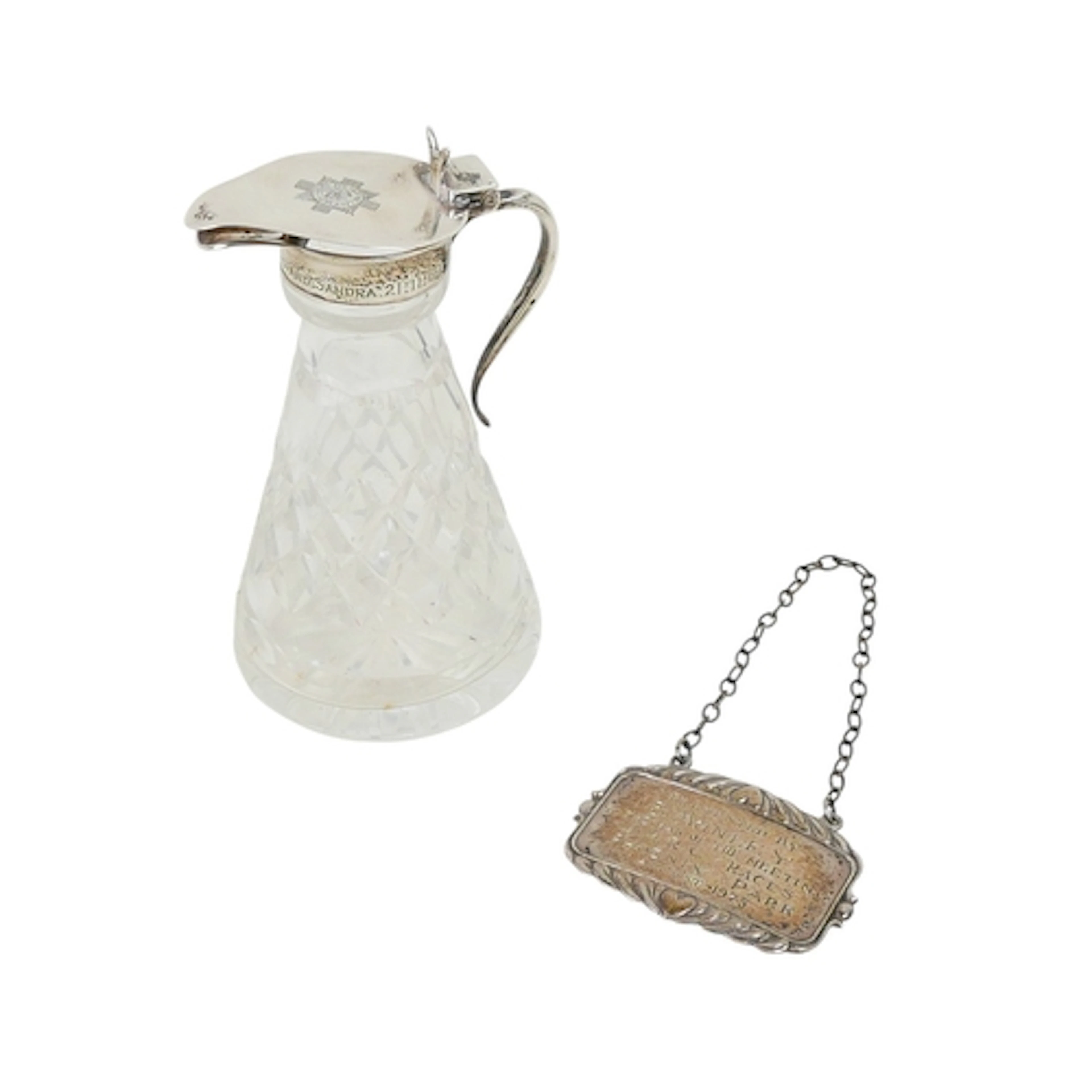 AN ELIZABETH II SILVER MOUNTED WHISKY NOGGIN AND SPIRIT LABE...