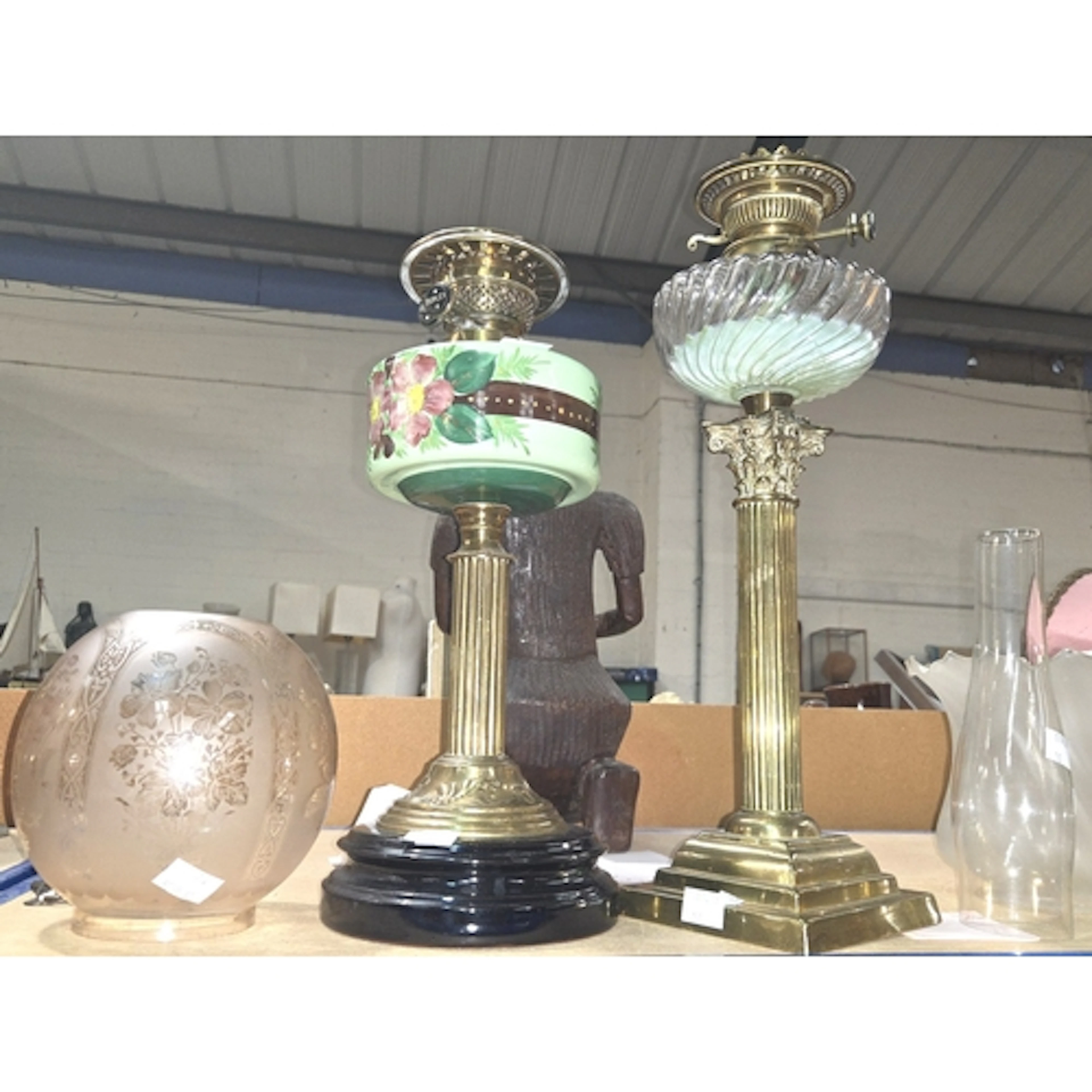 A brass column oil lamp with glass reservoir Shaw and Walker...