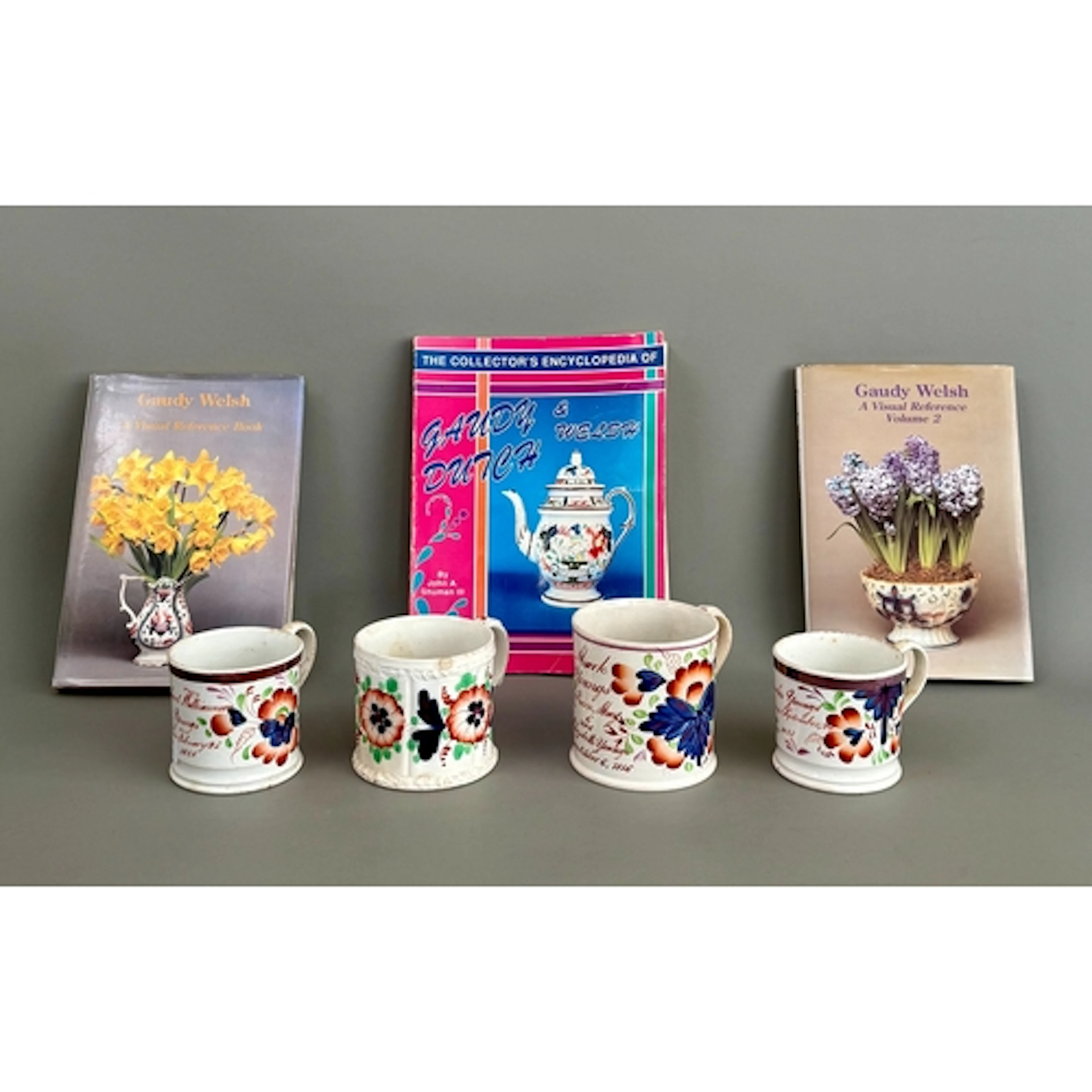 Four Gaudy Welsh mugs - including grape design, three inscri...