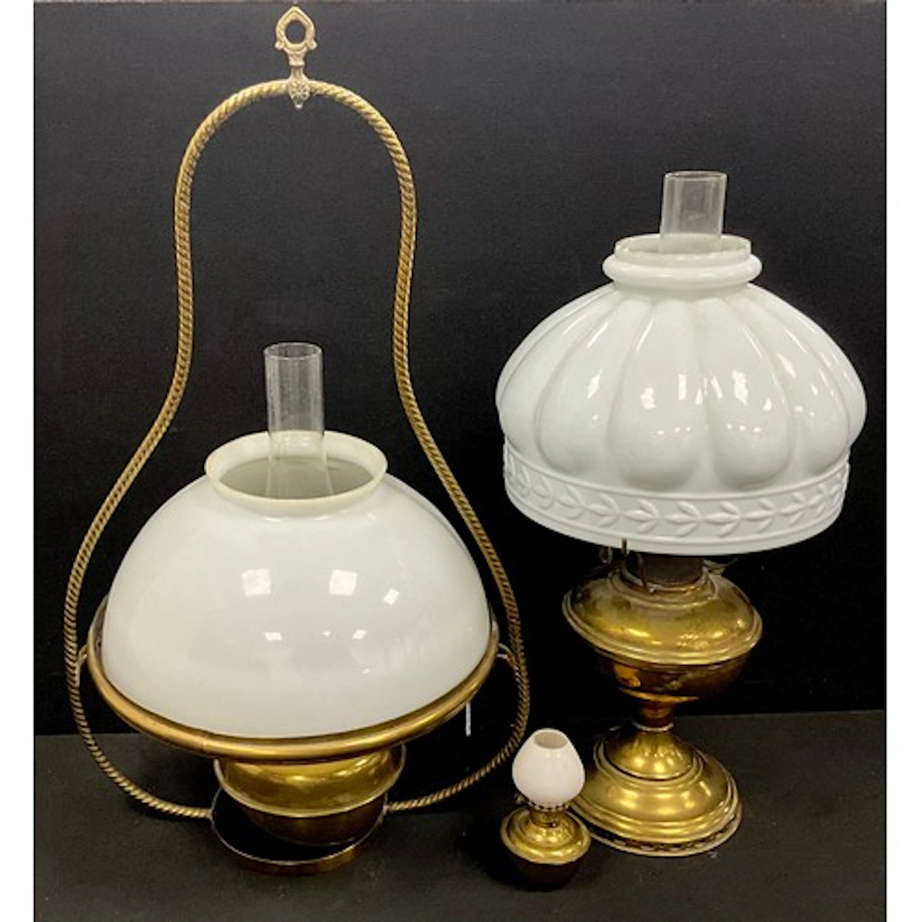 A 19th century hanging brass oil lamp, opaque white glass sh...