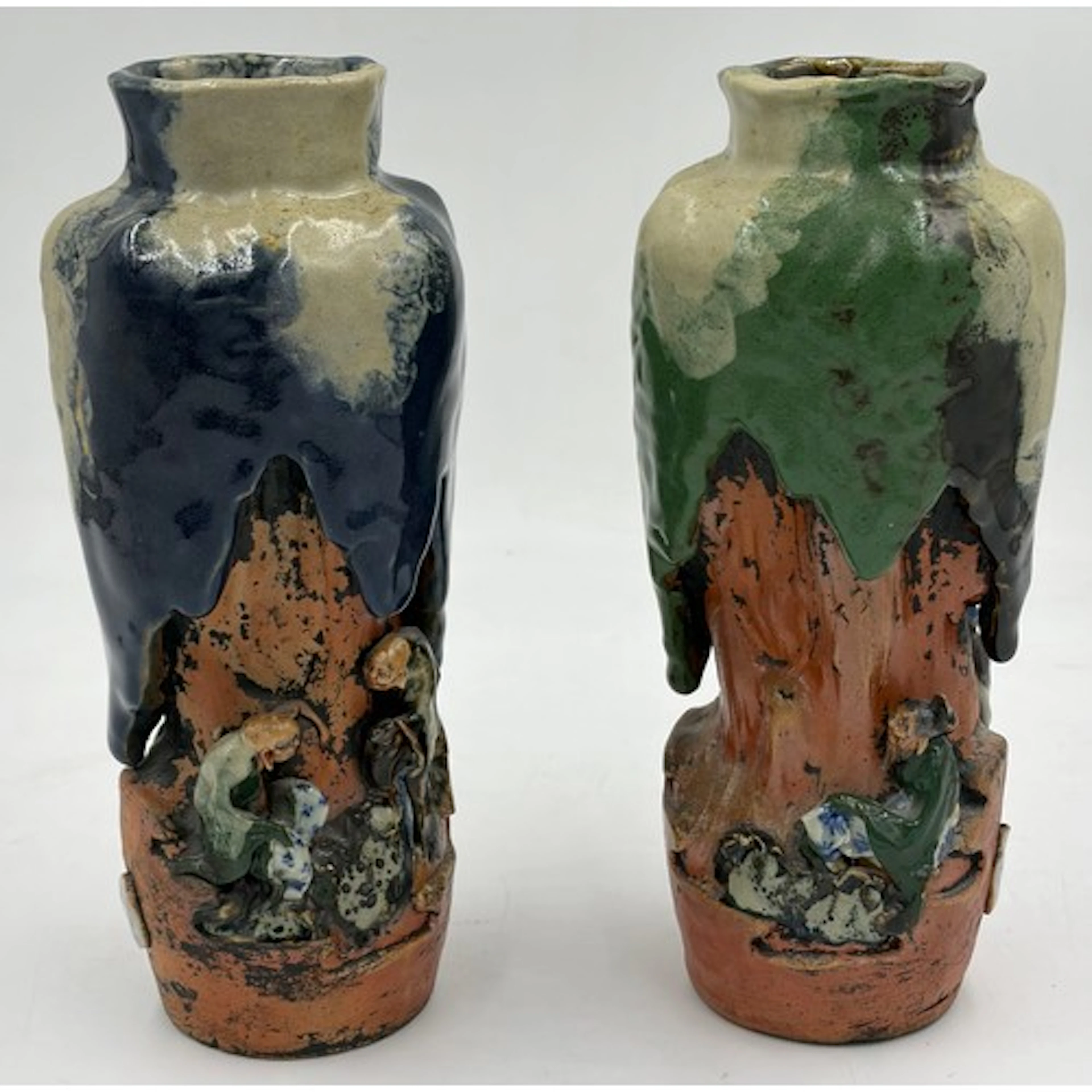 A pair of Sumida Gawa Vases, each with small figures seated ...