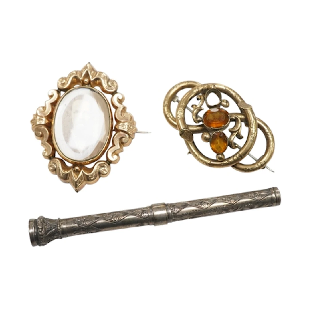 Two Victorian yellow metal brooches, one set with two (ex 3)...