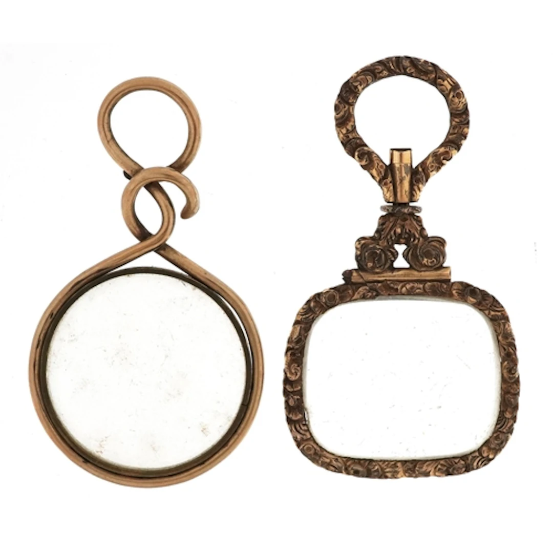 Two 19th century gilt metal quizzing glasses, the largest 6....