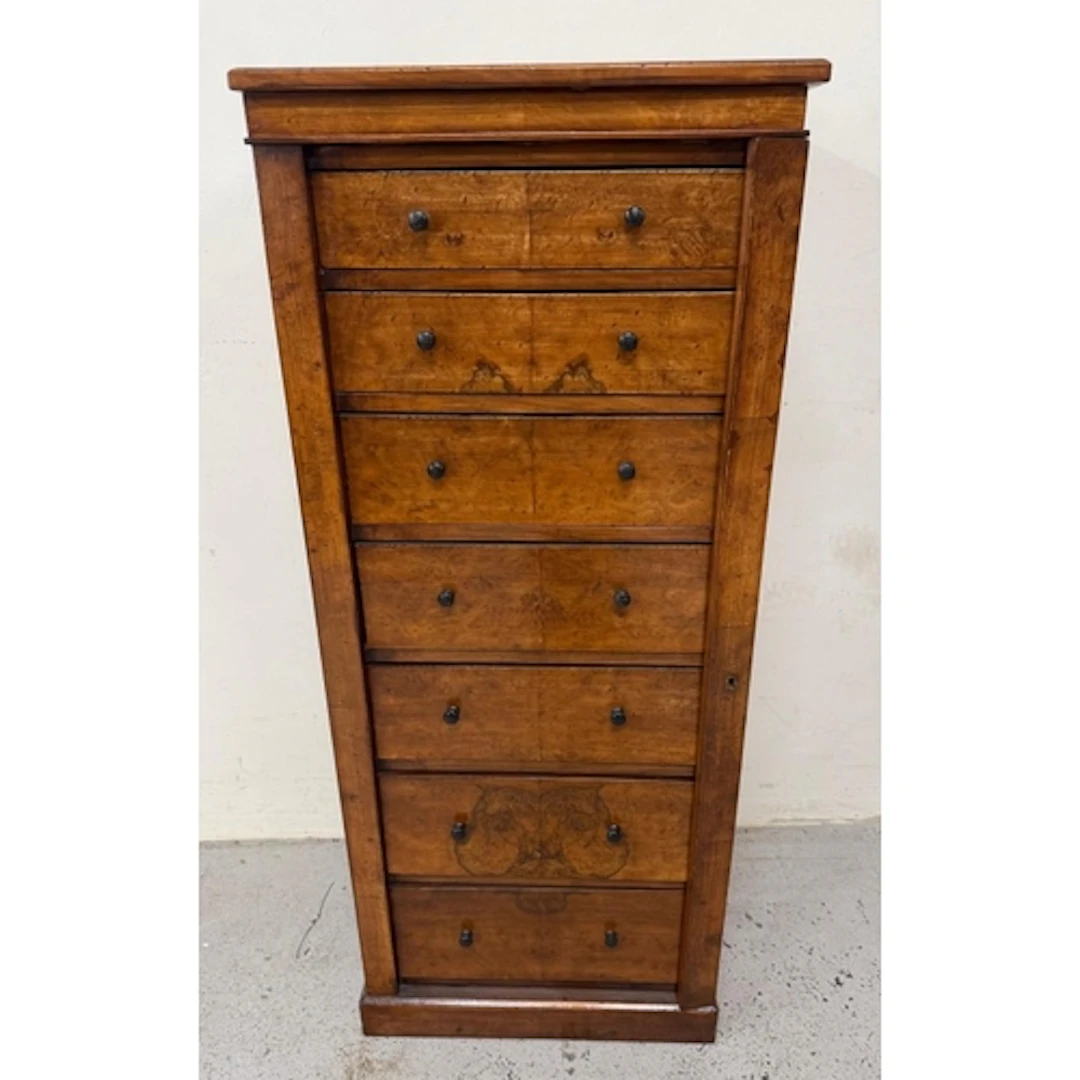 A Victorian wellington chest featuring graduated drawers and...