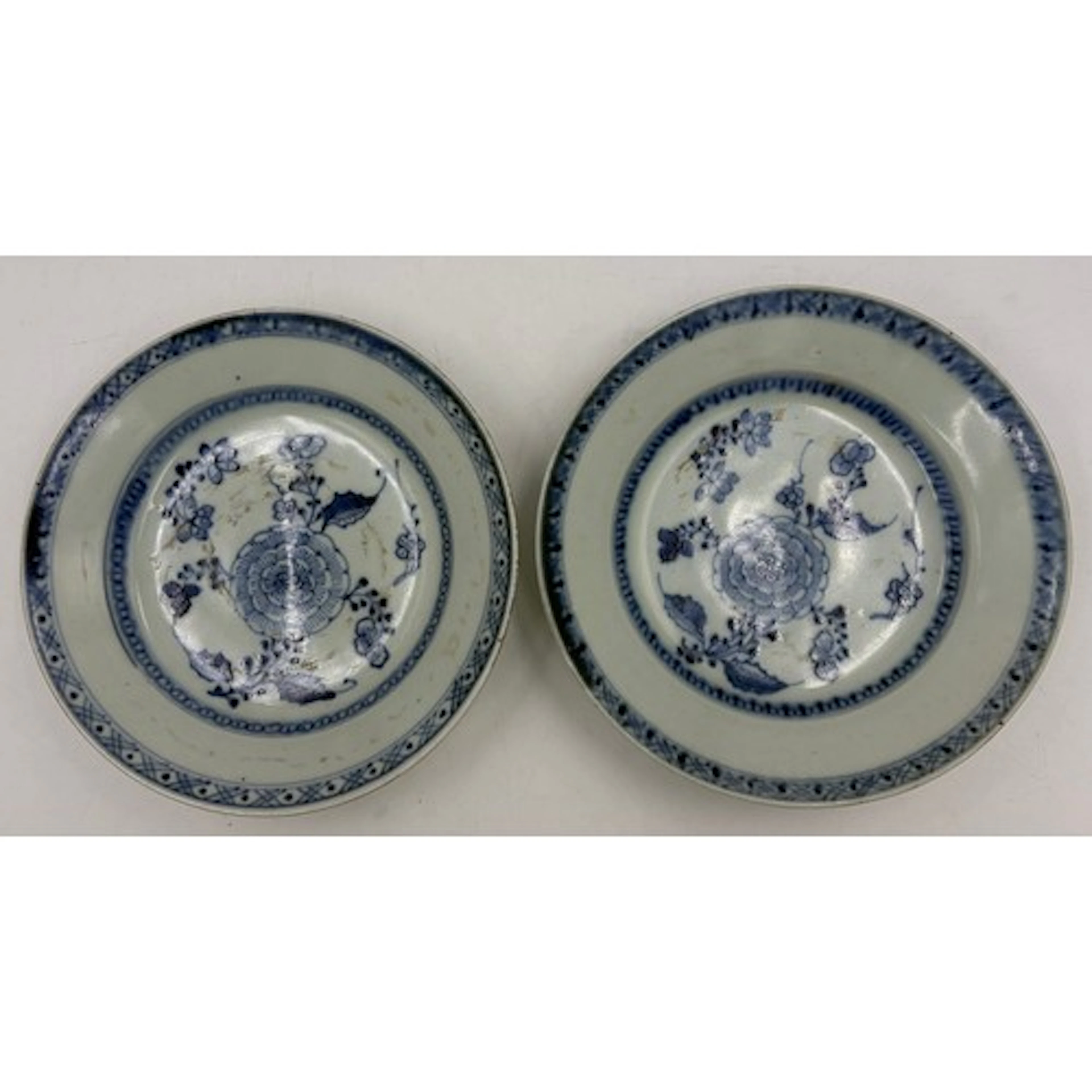 Two early 19thC Tek Sing shipwreck shallow plates with centr...