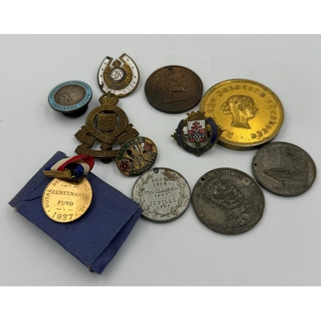 A small selection of military linked items to include cap ba...