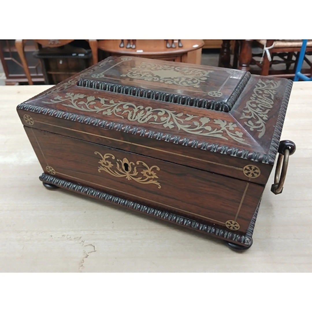 A George IV Regency Period brass inlaid rosewood sarcophagus...