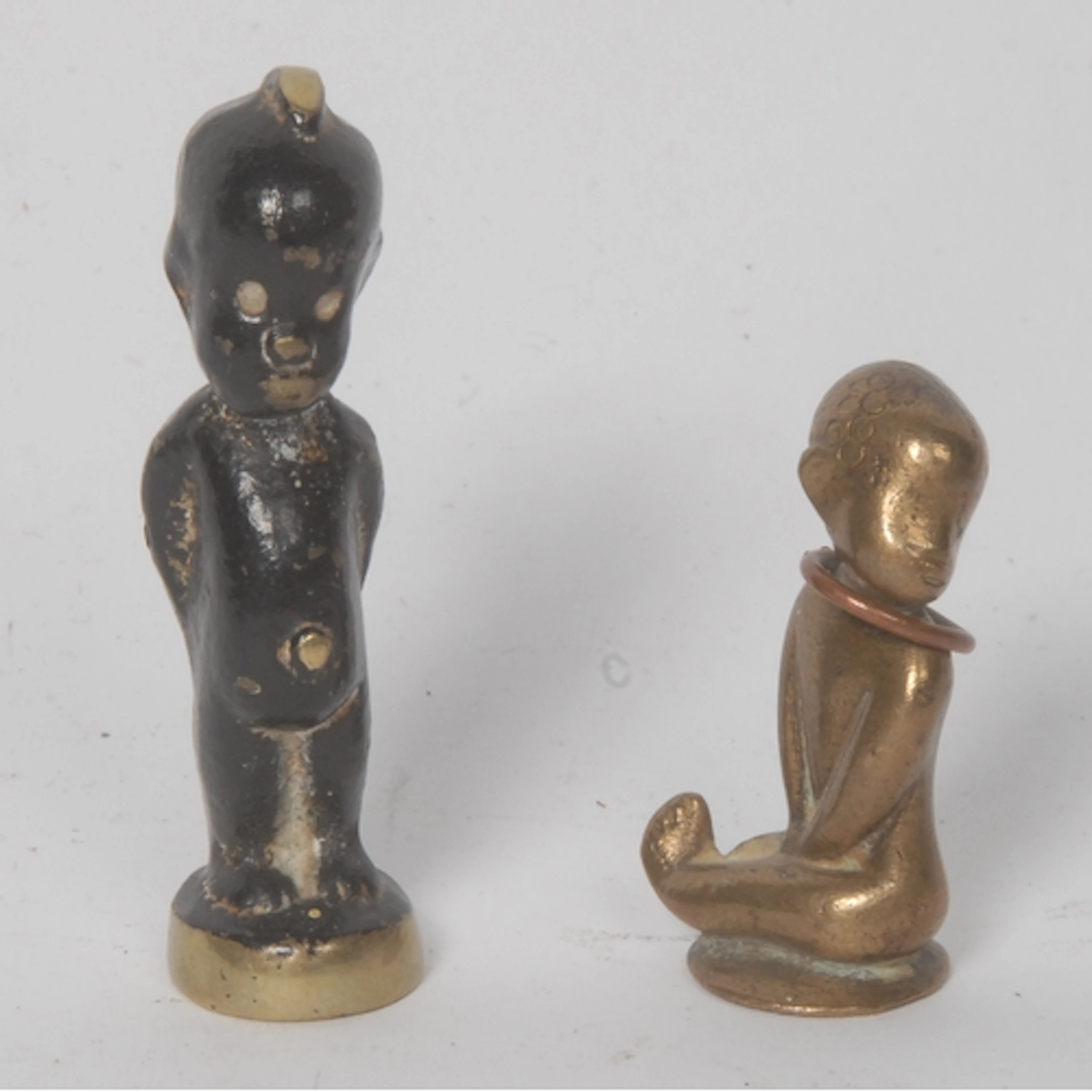 An Austrian bronzed metal miniature figure, of a seated Afri...