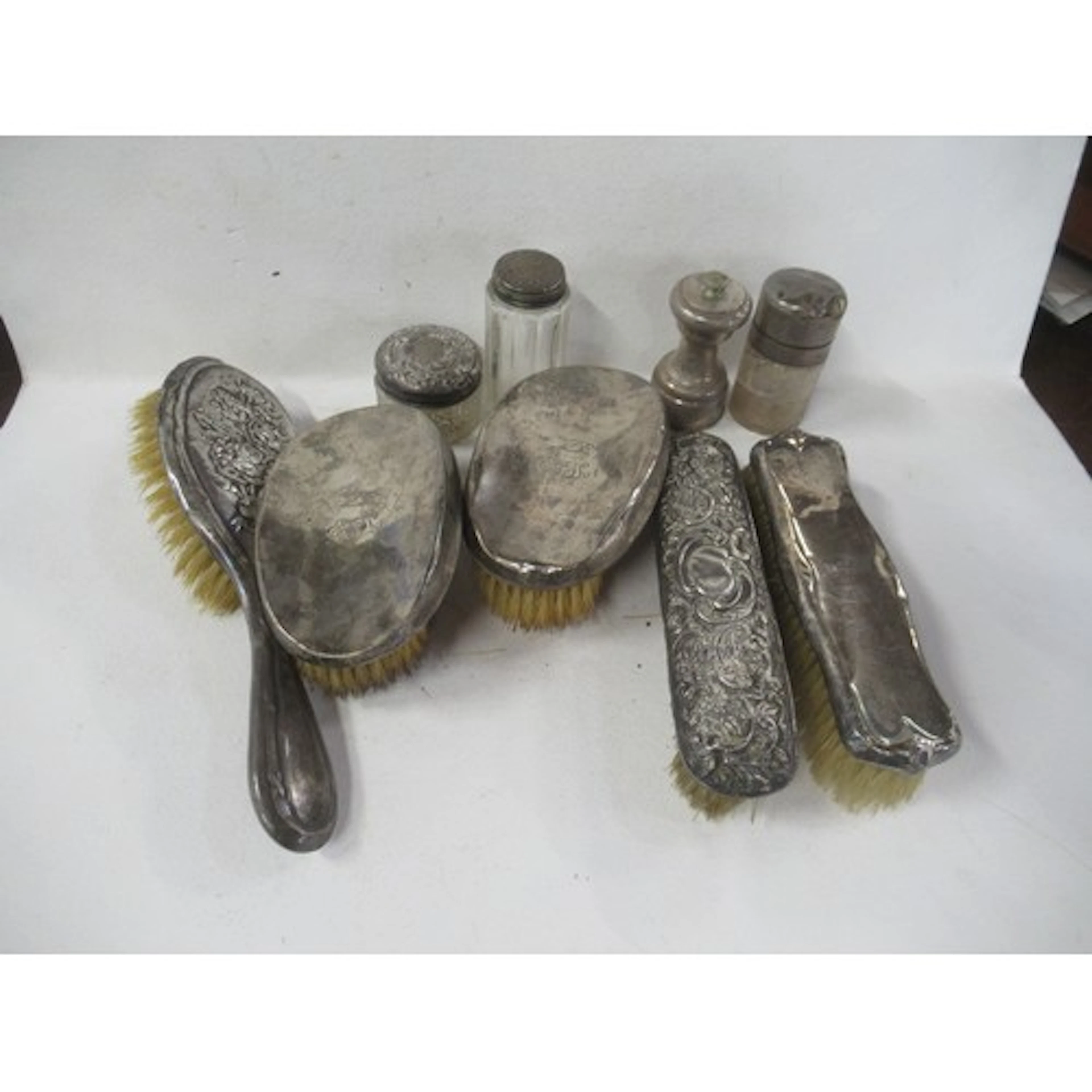 A collection of silver backed dressing table brushes, togeth...
