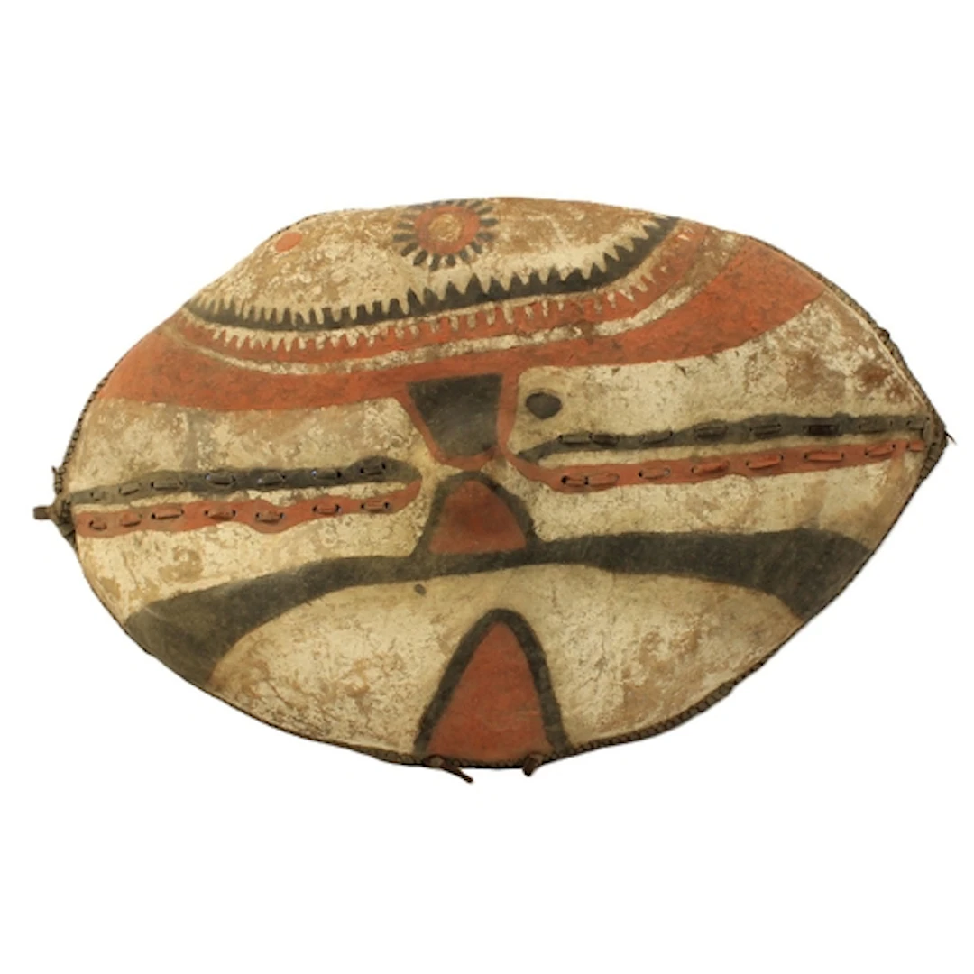Maasai tribal shield, adorned with white, red and black geom...